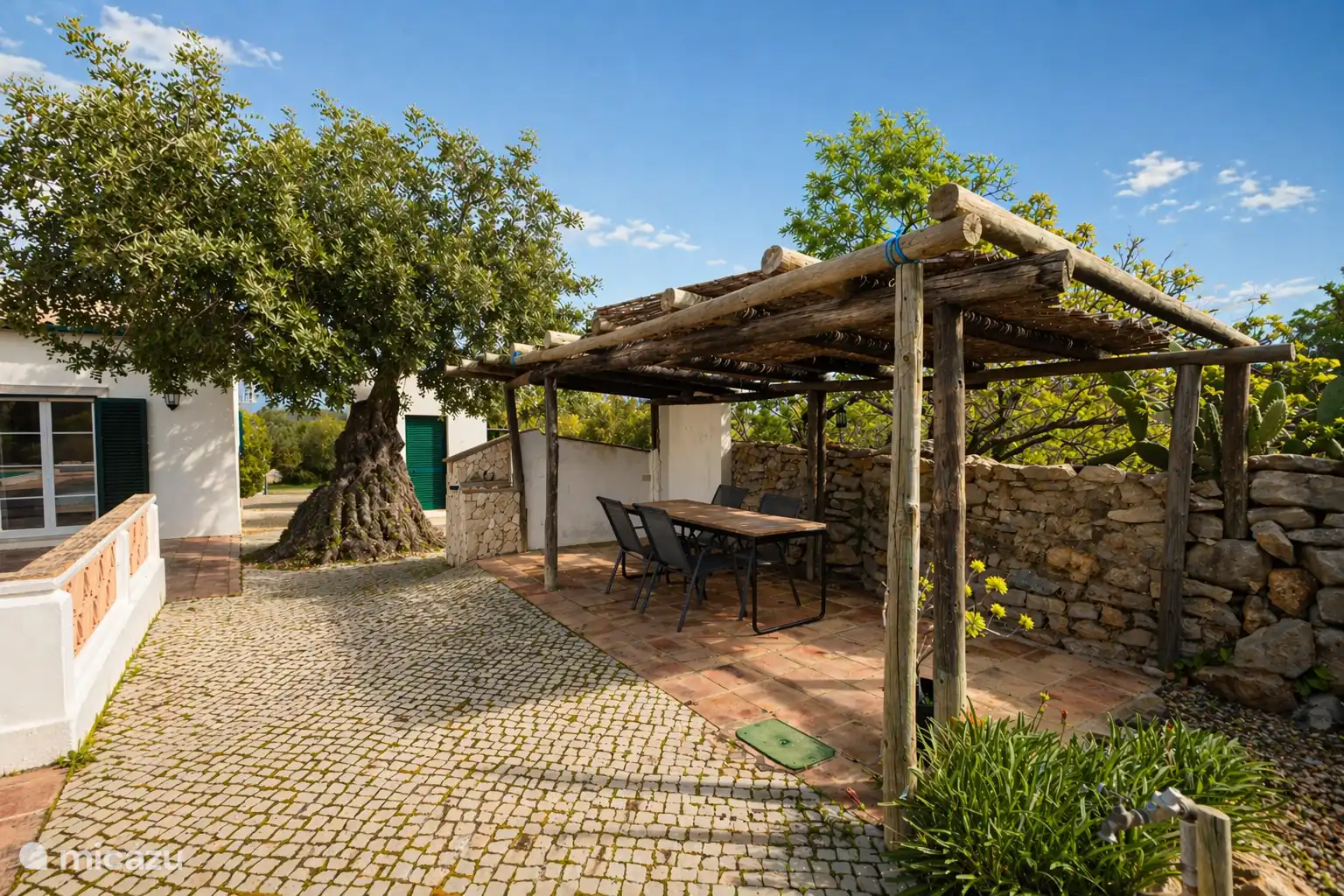 Shaded dining area near the BBQ