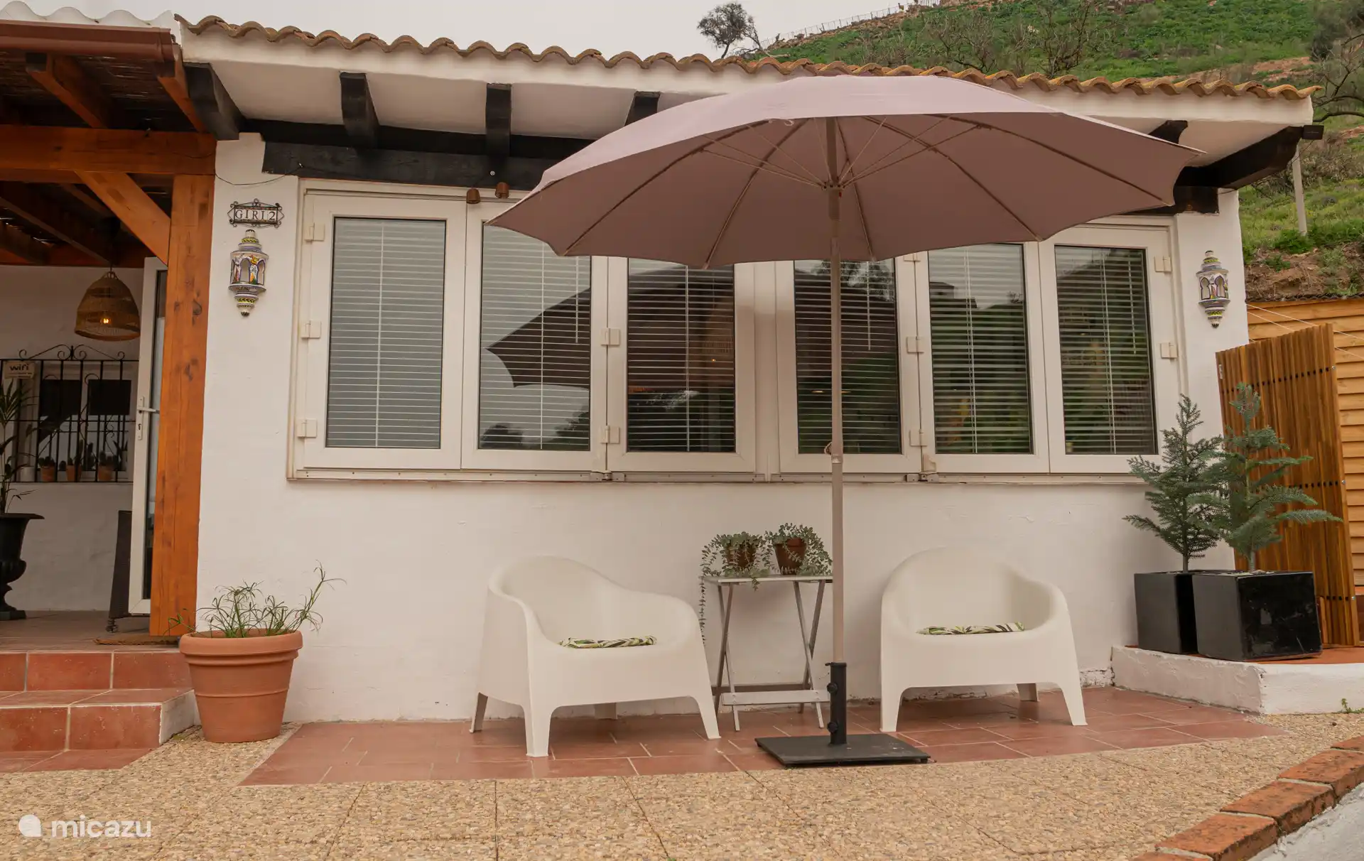 terrace with a view over the pool and garden