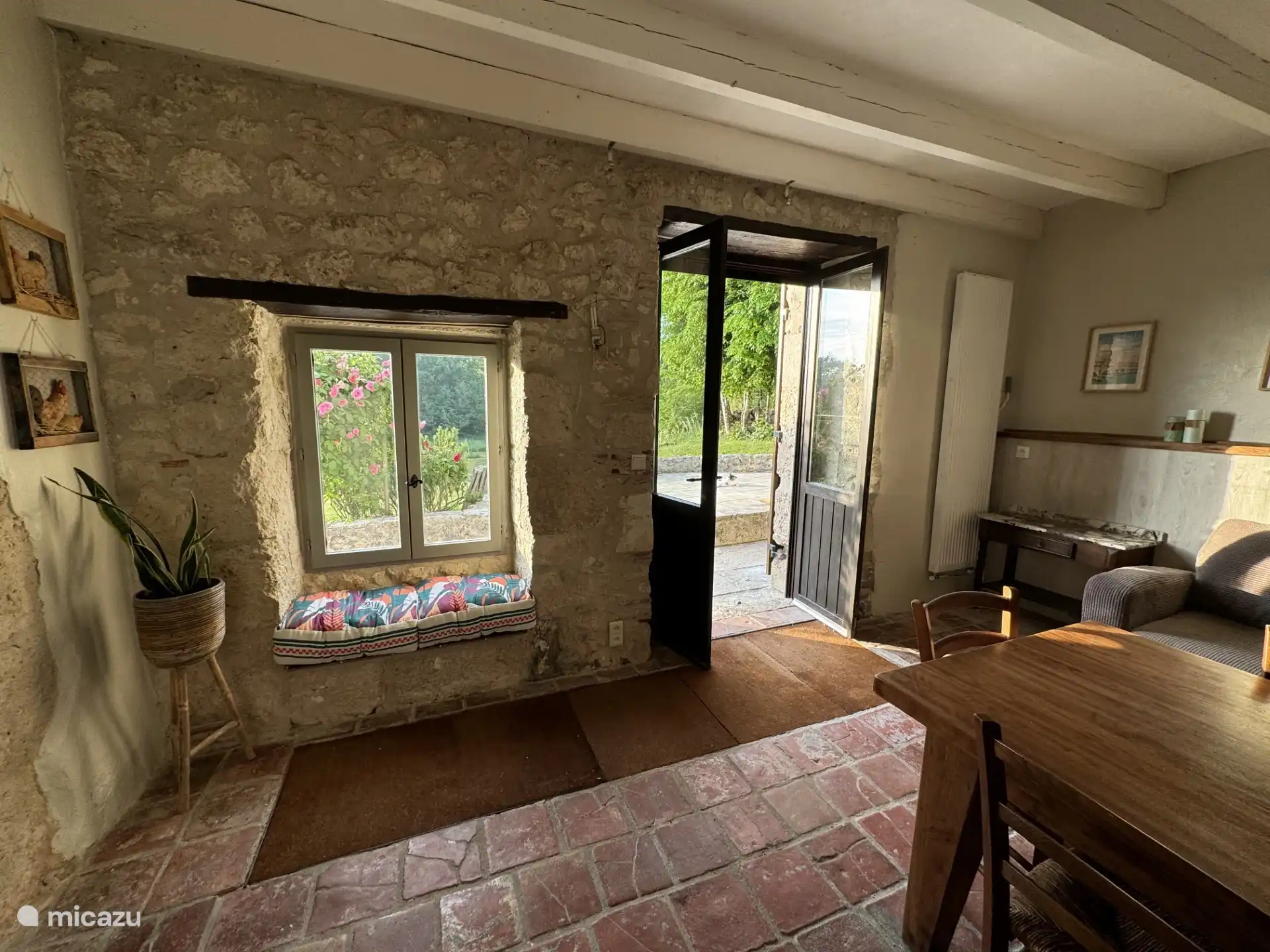 Spacious, fully equipped kitchen with large dining table.