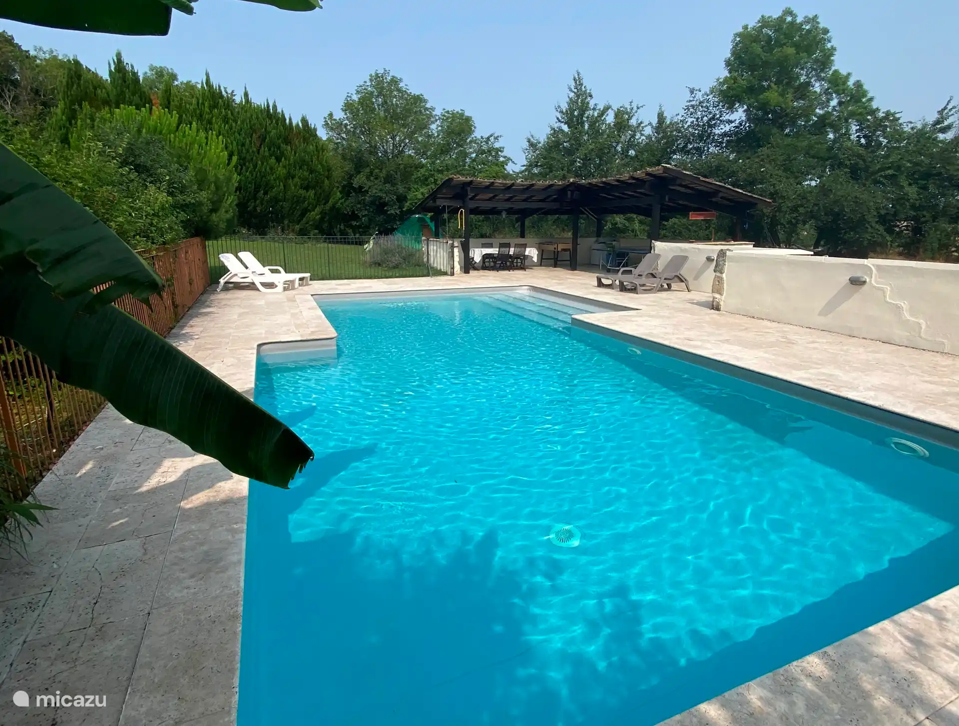 Private swimming pool with sun terrace, sunbeds, umbrellas canopy with dining table and ping pong table.