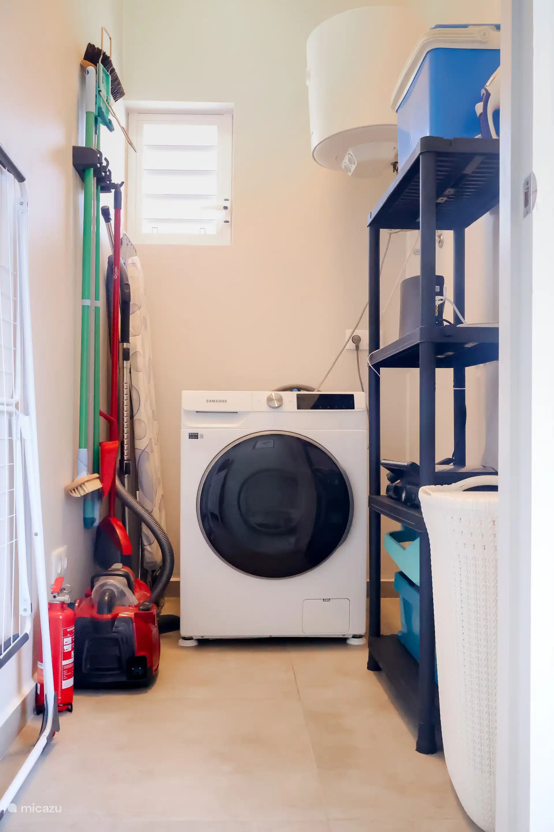 The storage room is equipped with a washing machine, cleaning equipment, vacuum cleaner, cooler, boiler, drying rack, ironing board, iron and drying rack.