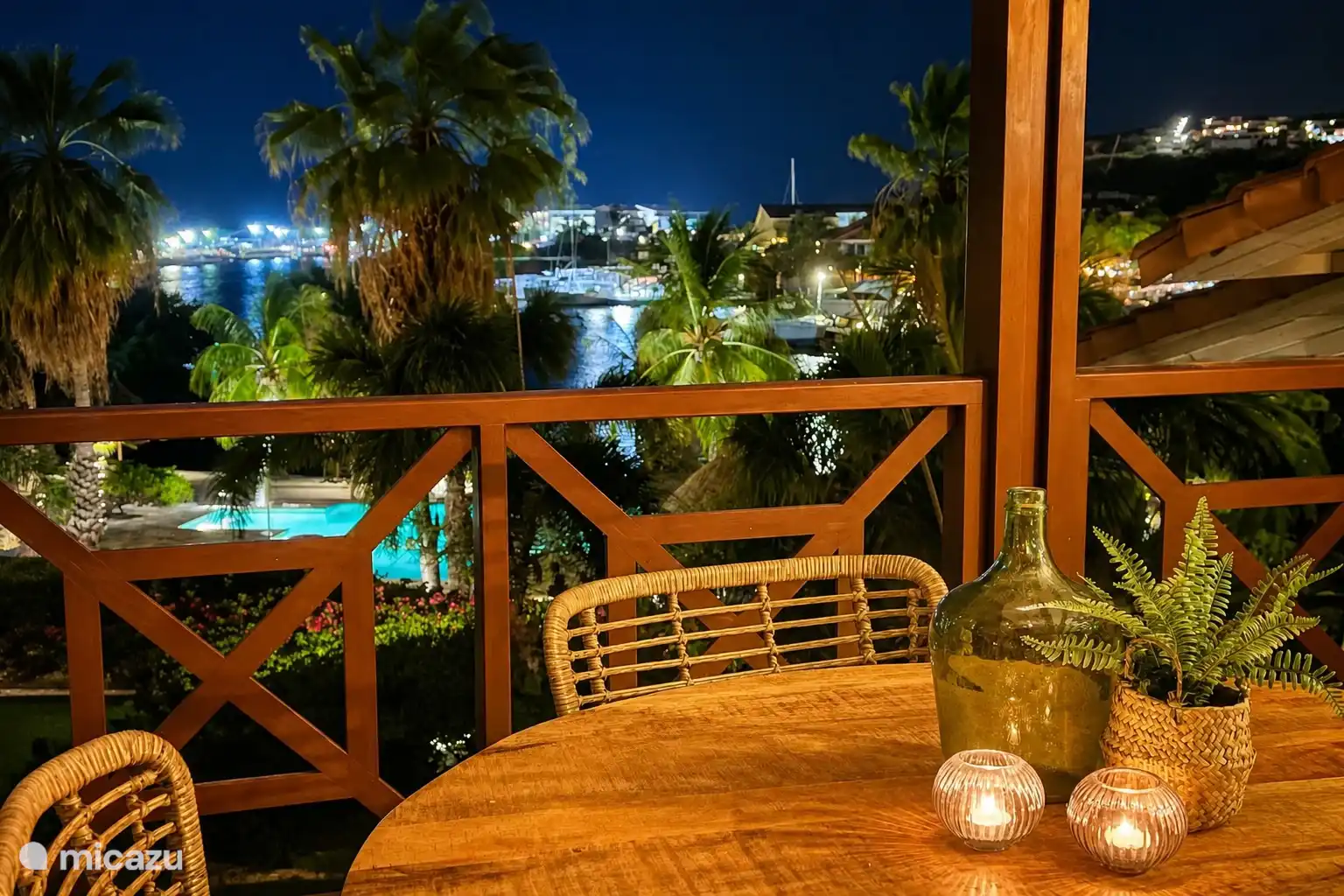 Fantastic view from the balcony in the evening. The Spanish Water and the marina come alive with lighting.