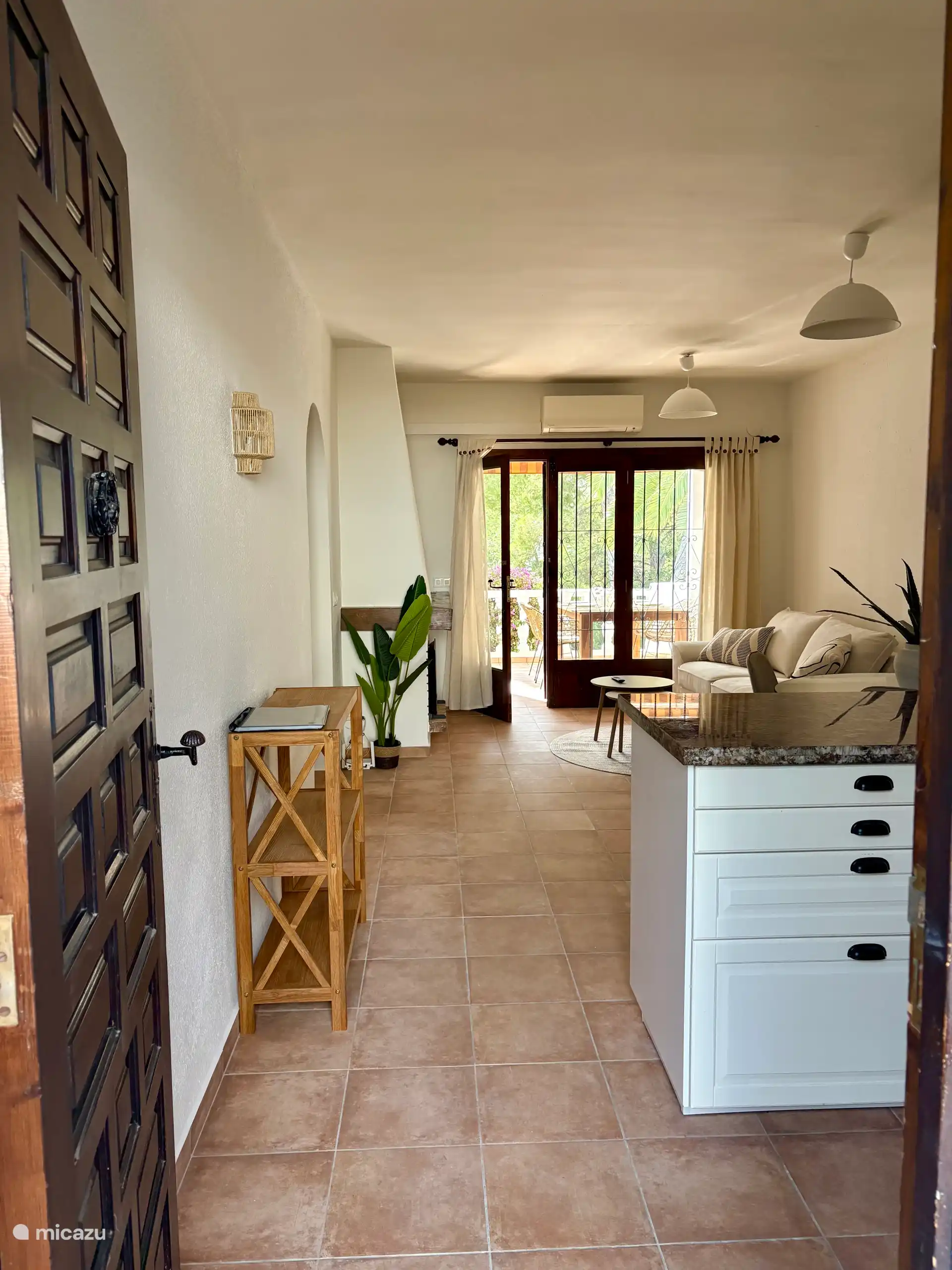 As soon as you open the front door, you step into a bright and charming apartment with beautiful authentic Spanish details - Living-dining room