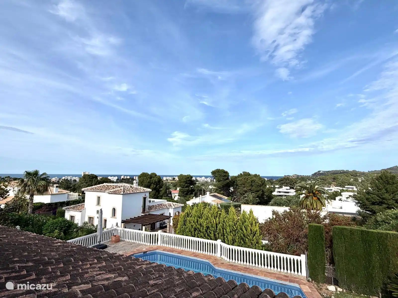 View of the swimming pool and Cala Blanca from the terrace accessible from Bedroom 1