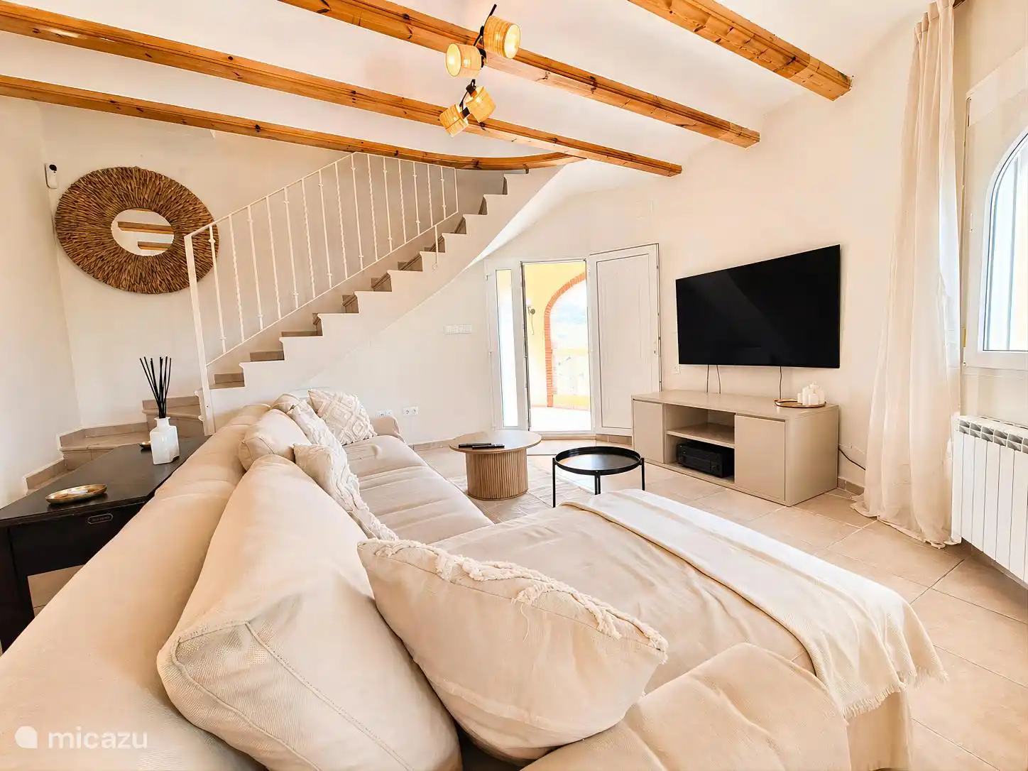 living room with sofa and access to veranda