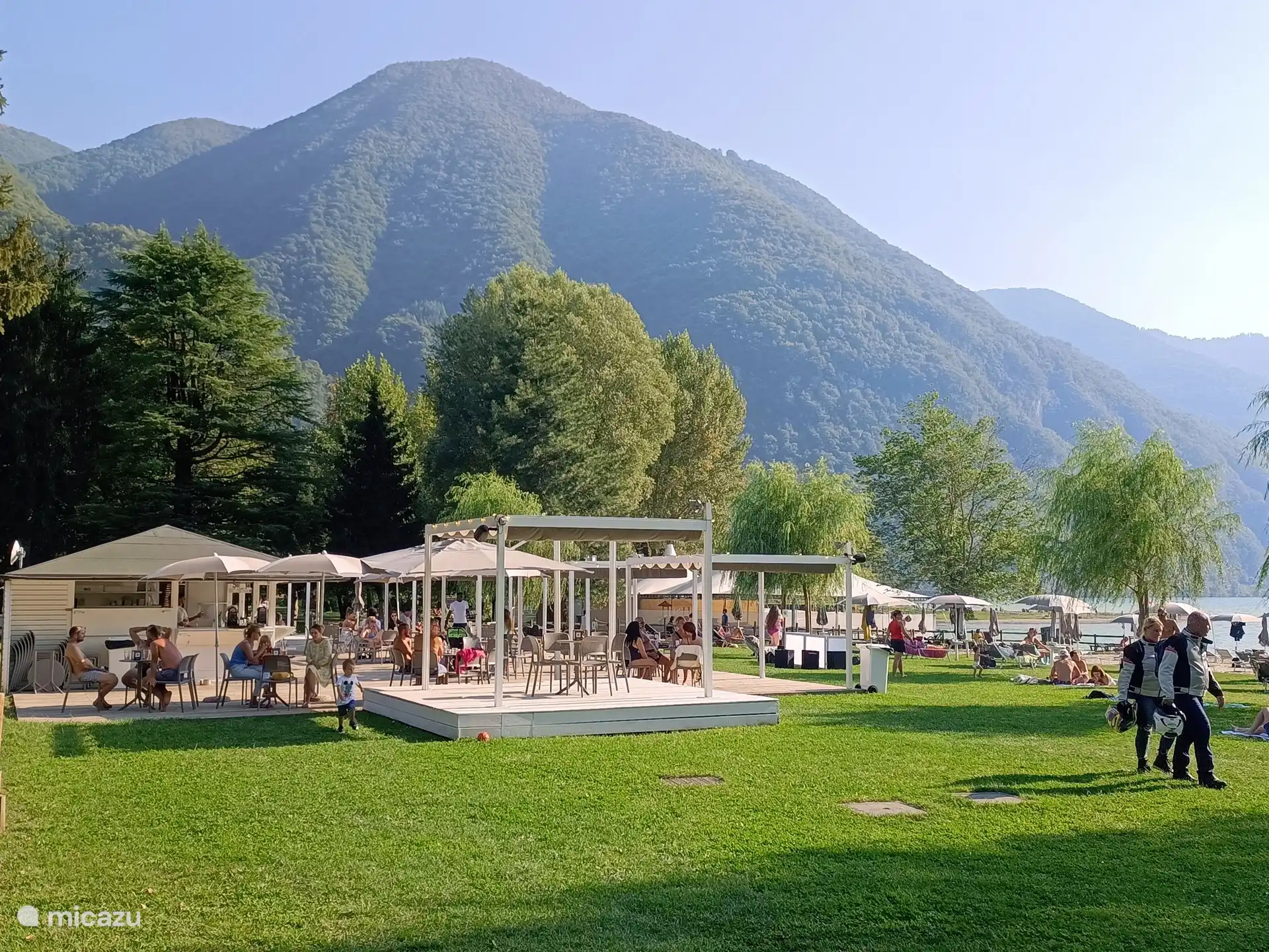 In summer, on the edge of Lake Lugano.