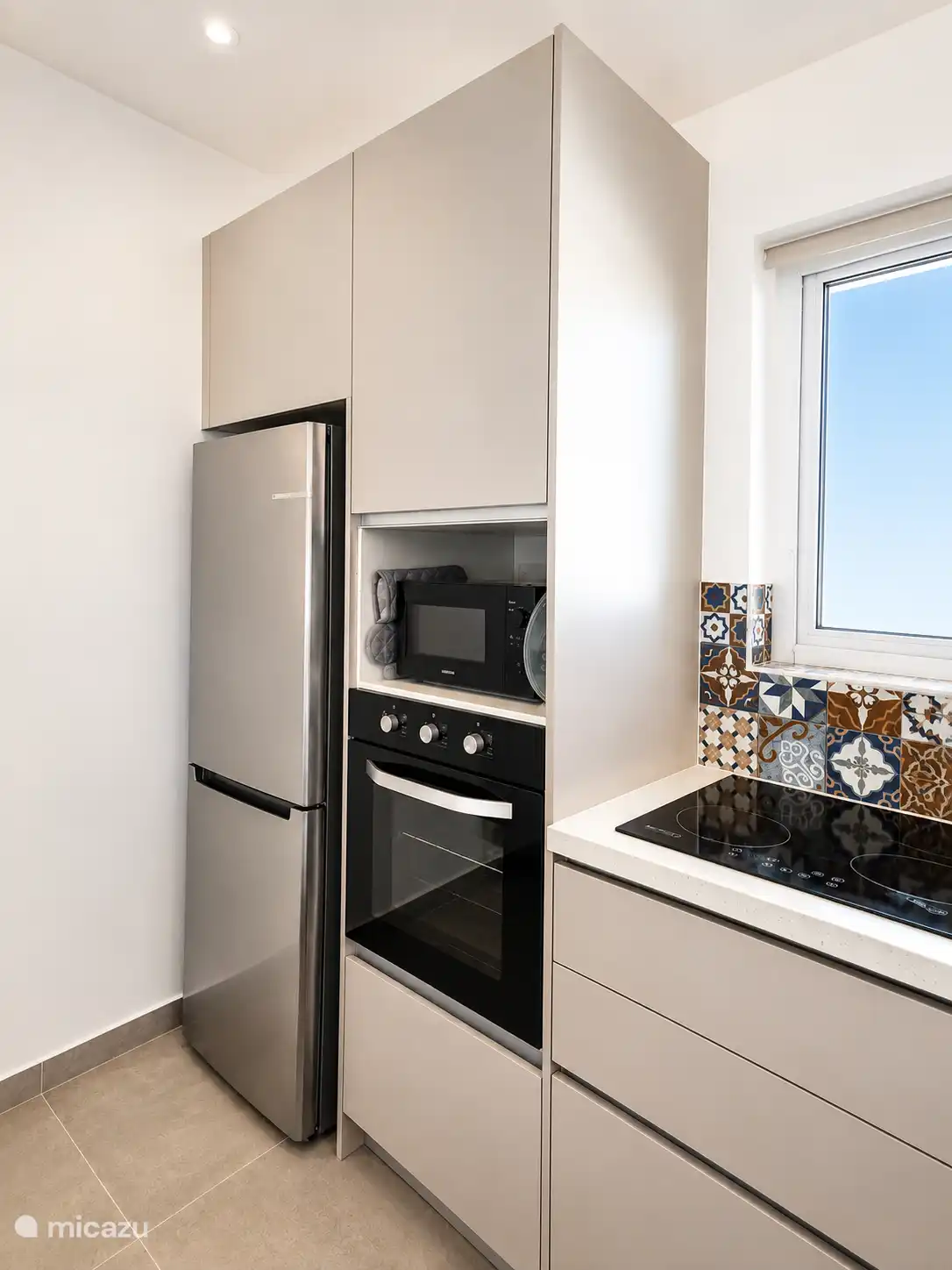 Large fridge-freezer, microwave and oven