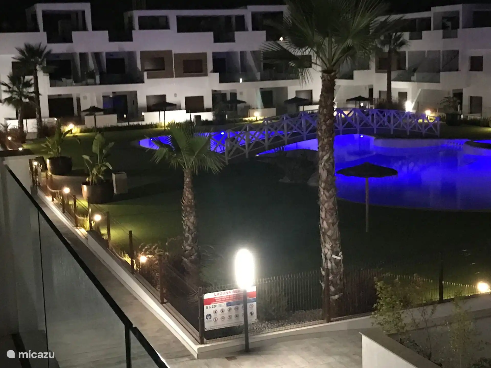 Evening view of the illuminated swimming pool