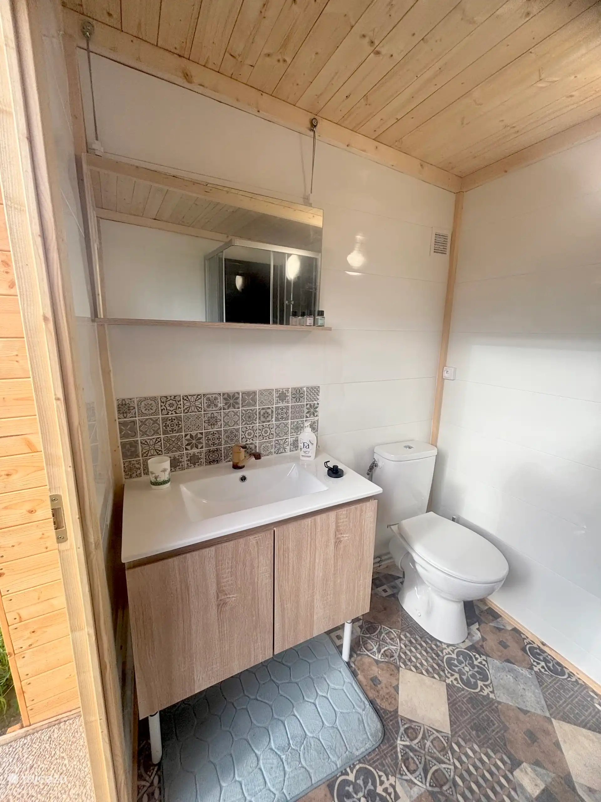 Bathhouse with toilet, sink and shower