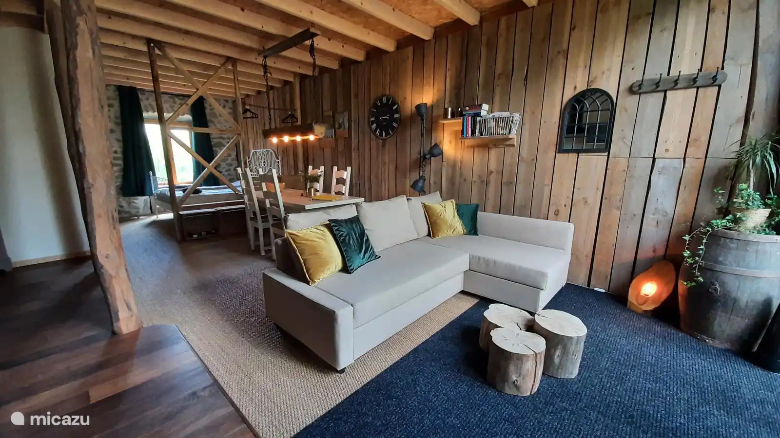 Spacious living area with lots of reclaimed wood