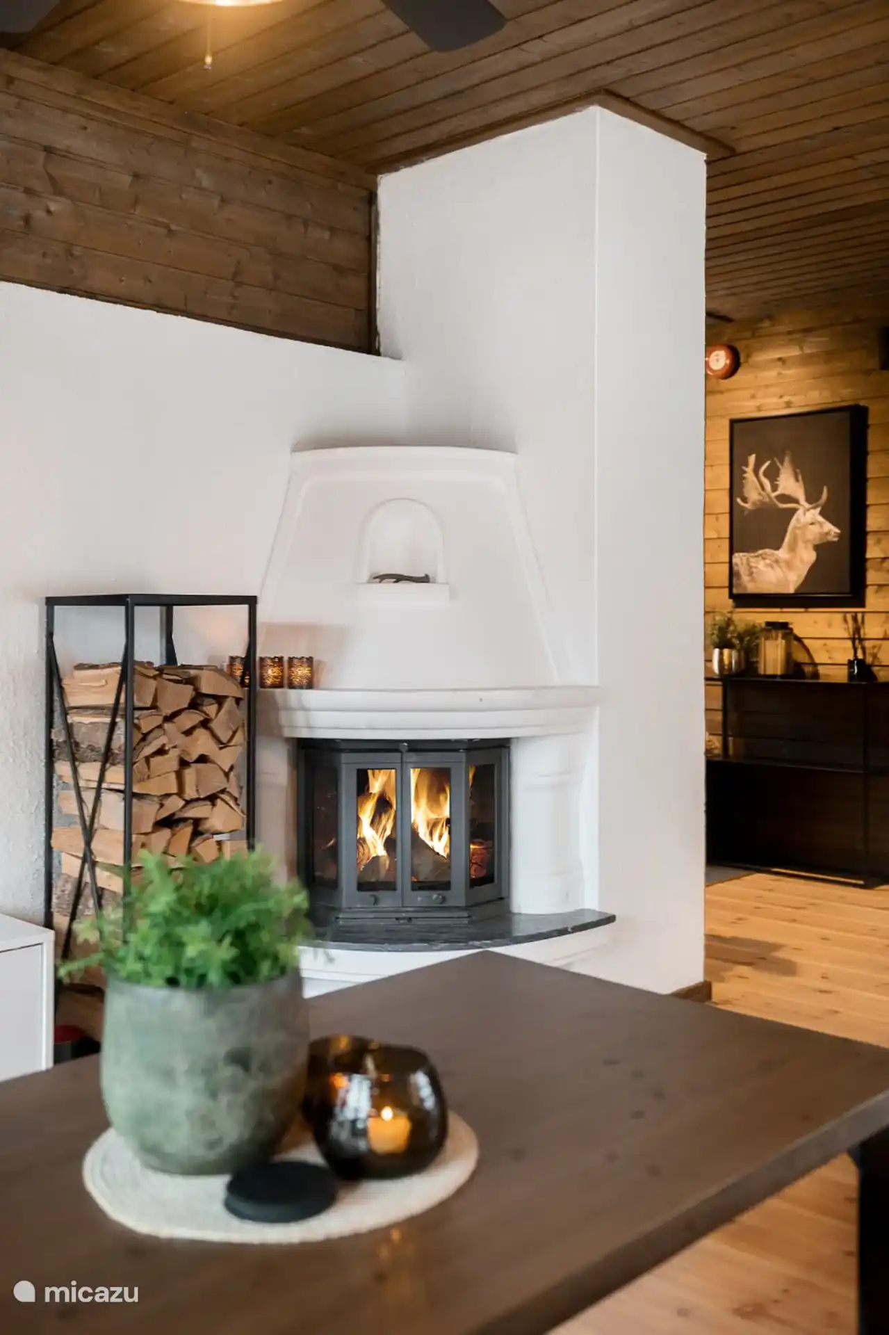 Characteristic Norwegian fireplace with sufficient firewood available