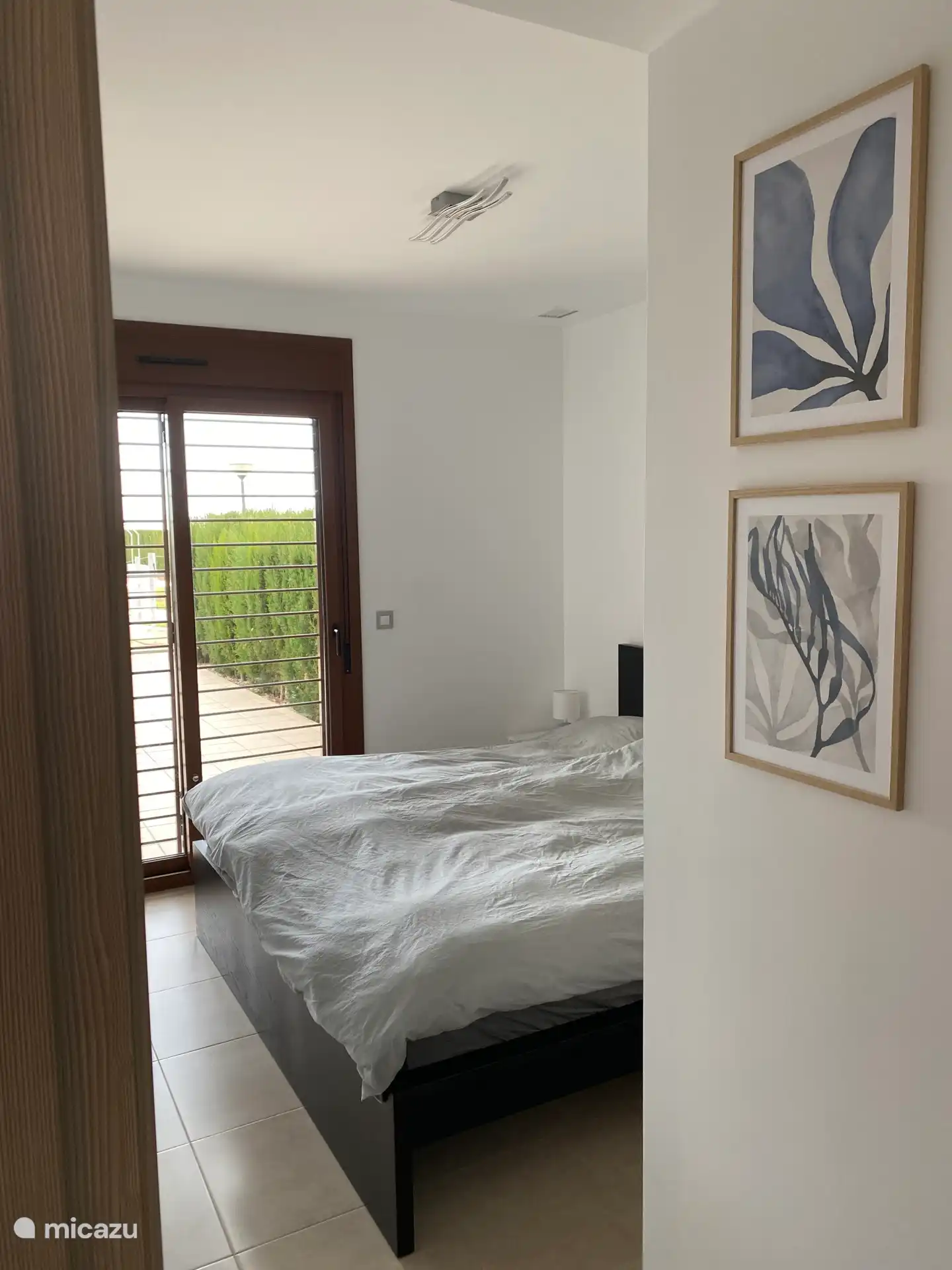 Bedroom 1 with double bed and access to terrace.