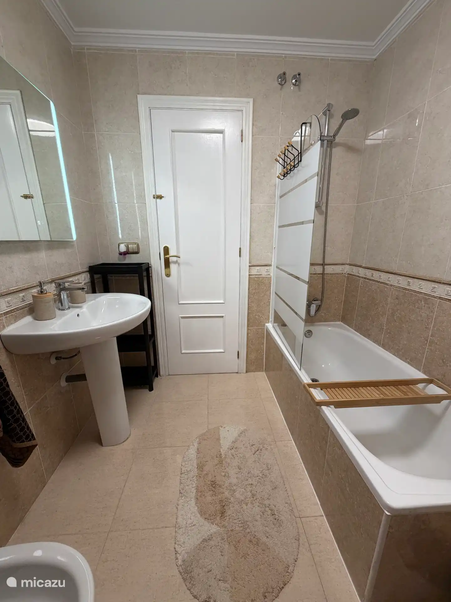 Bathroom with toilet, bidet, bath/shower