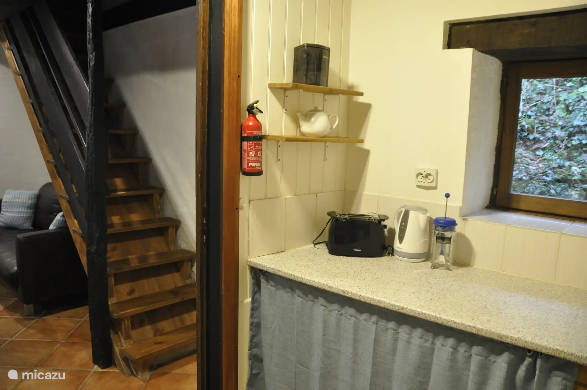 Kitchen area with gas hob, oven, kettle, cafetiere, microwave, toaster, dishwasher, fridge-freezer