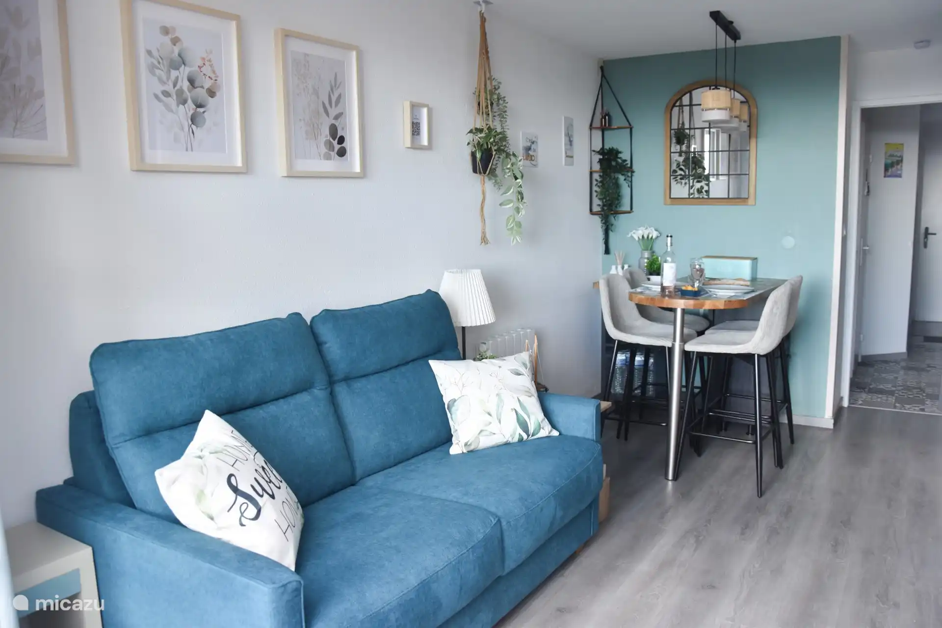 The living room, with its sofa bed and dining area