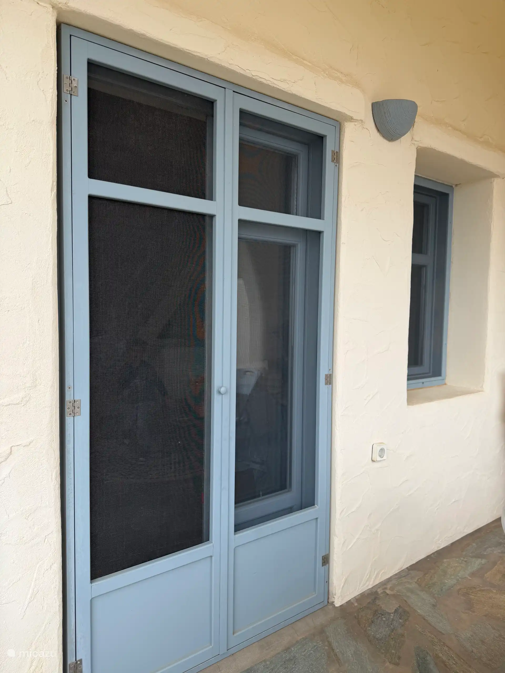 French doors from balcony to living room