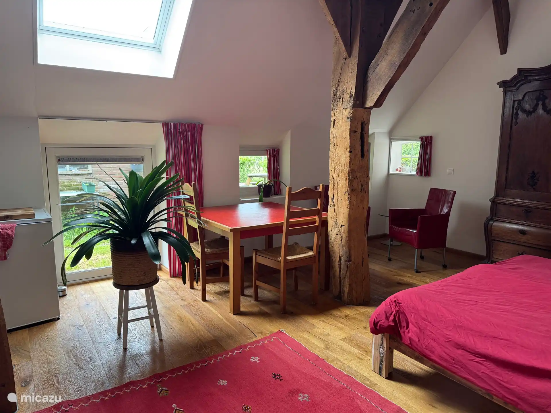 Living room with bed and kitchen area