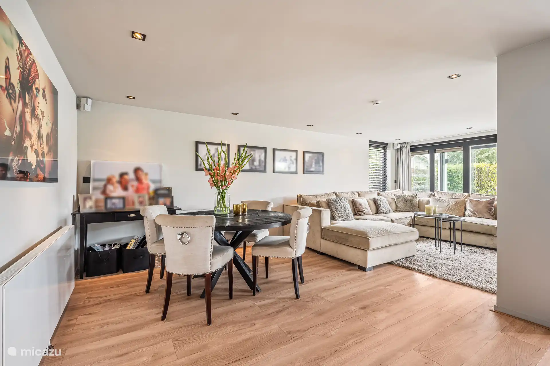 Modern open kitchen with dining area and lots of light.