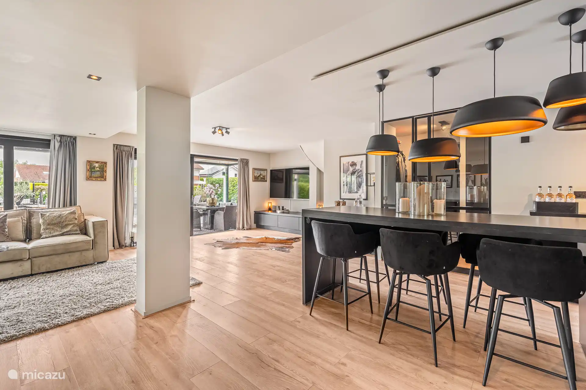 Comfortable living room with stylish décor and views to the outside.