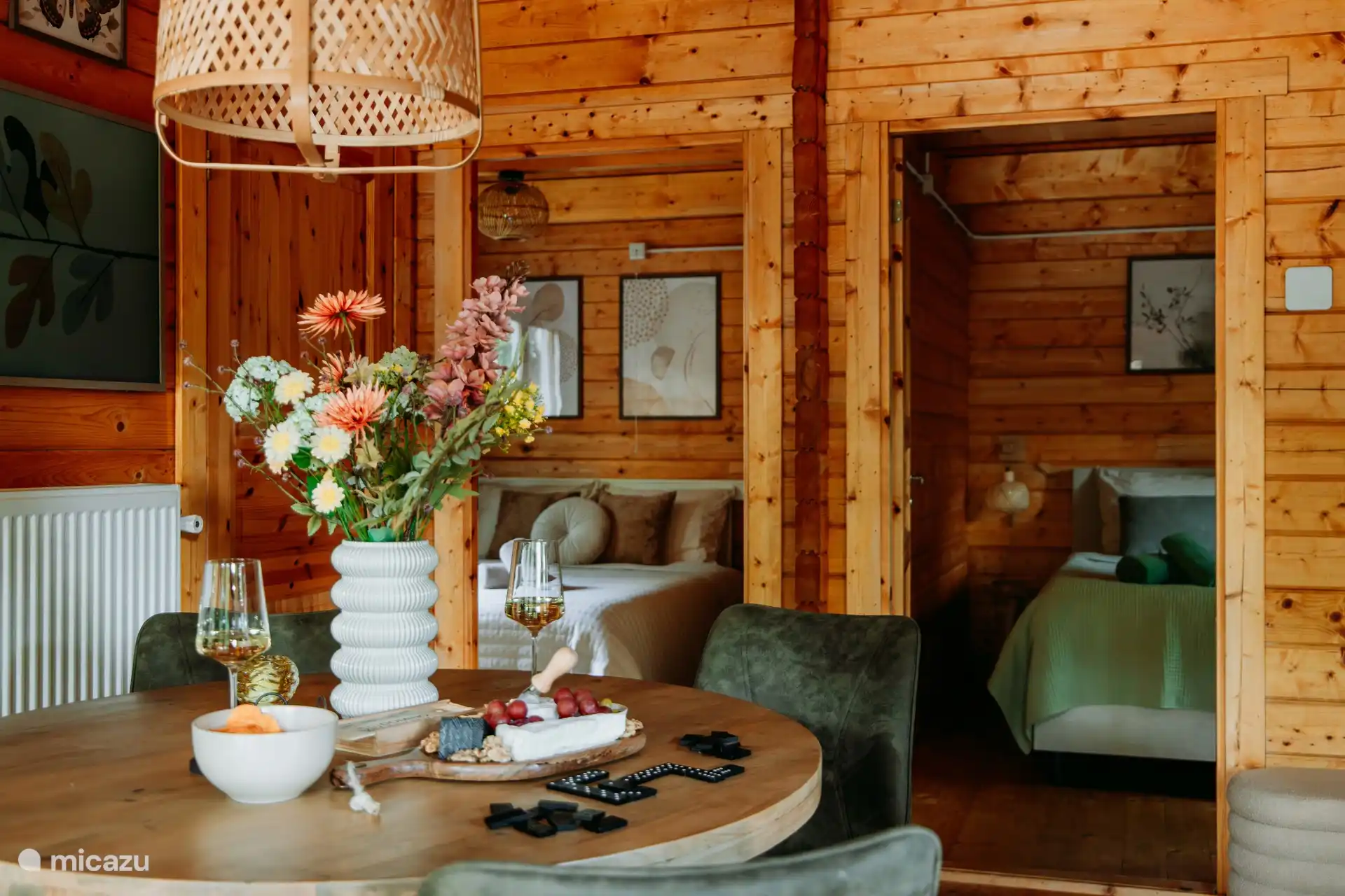 Cozy round dining table with four comfortable chairs.