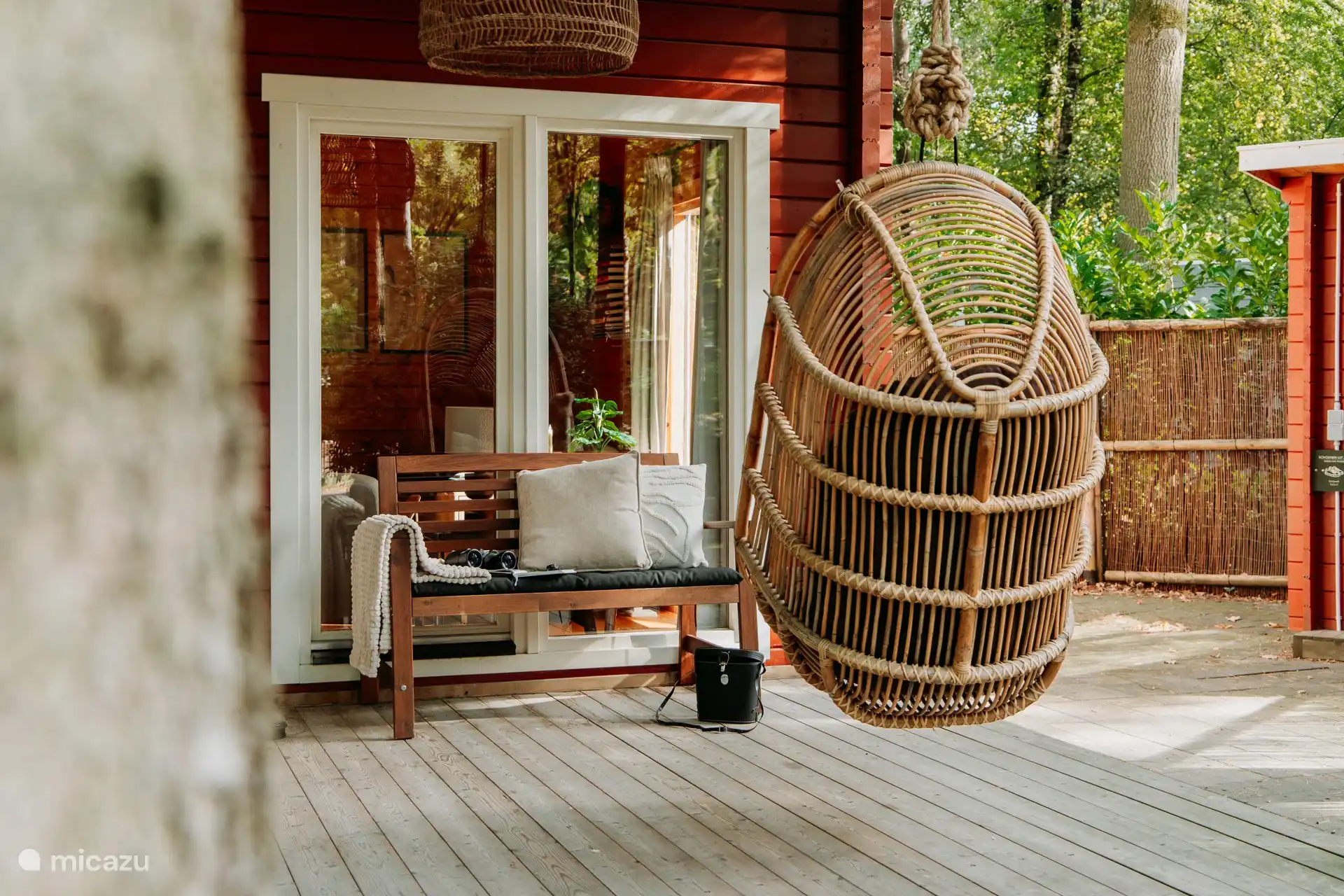 Enjoy the green surroundings from the hanging chair or bench.