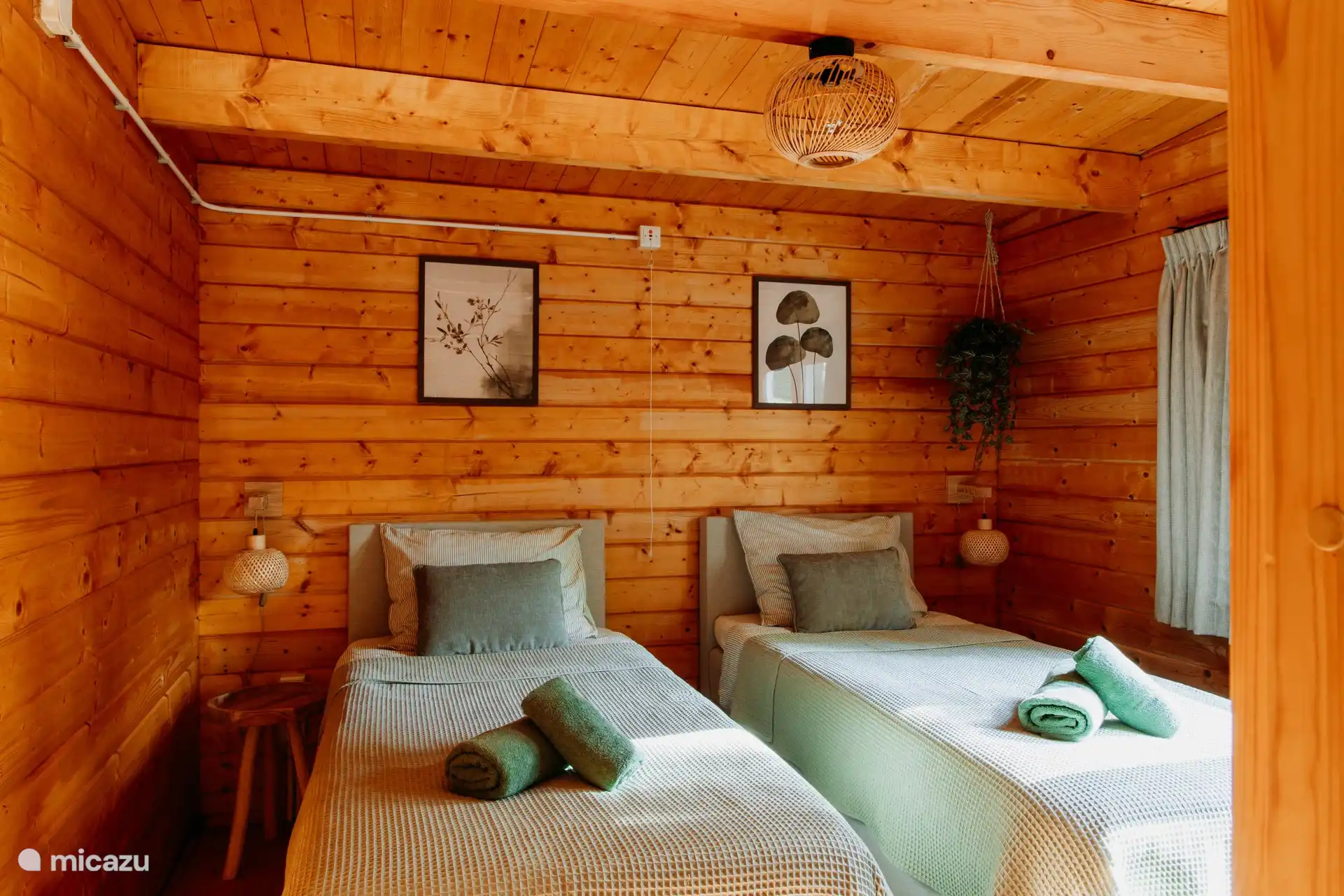 Beds made and linen are included. The two separate box spring beds can be pushed together.