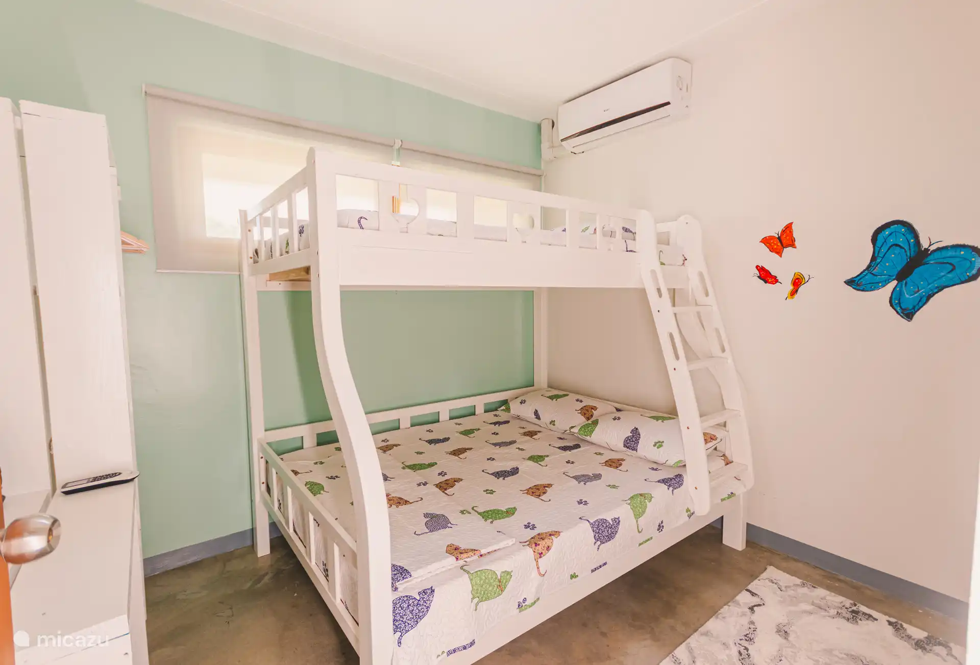 In the children's room, a bunk bed is suitable for 3 children up to 12 years old