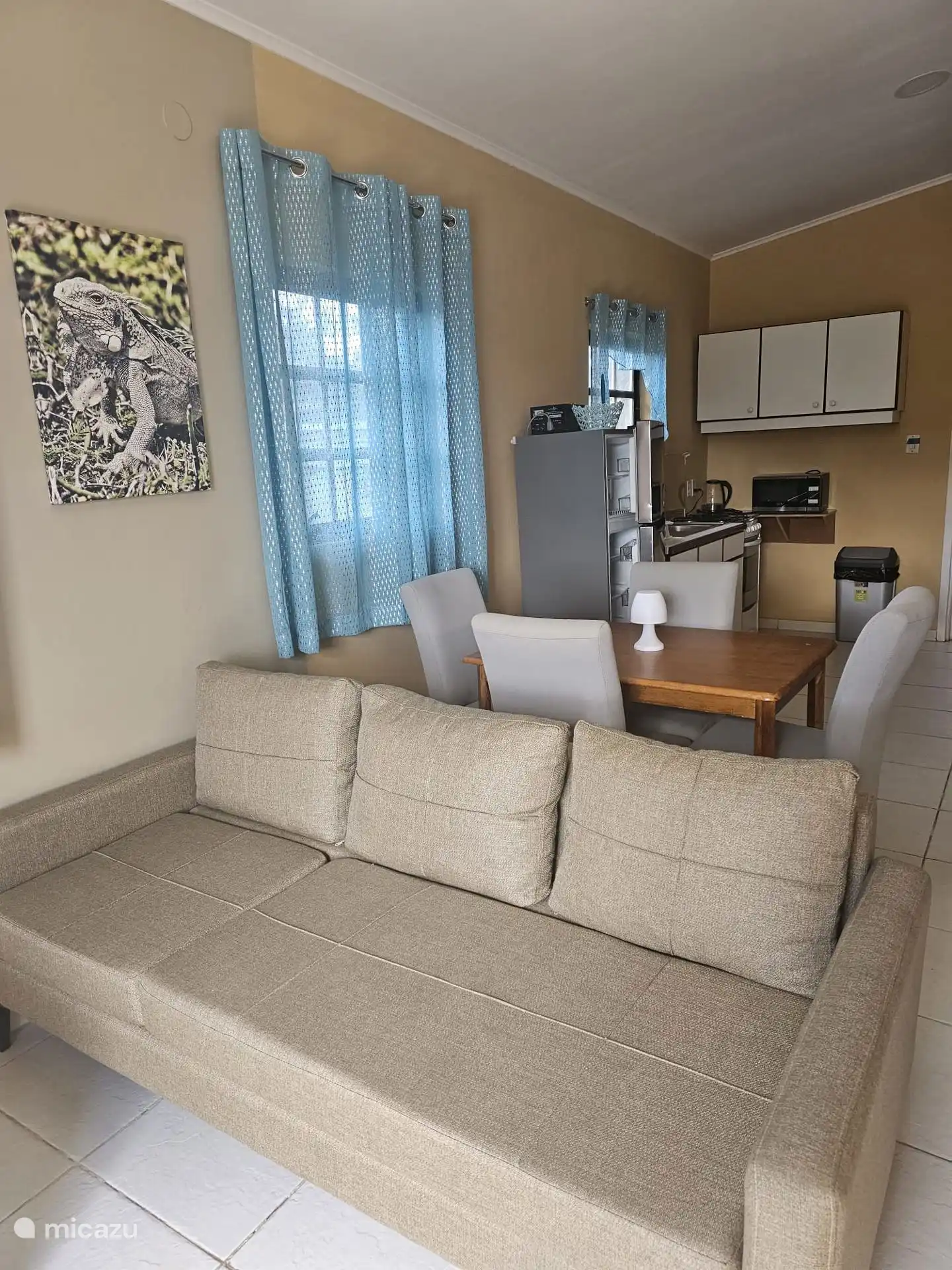 The dining table with chairs form a cozy dining area