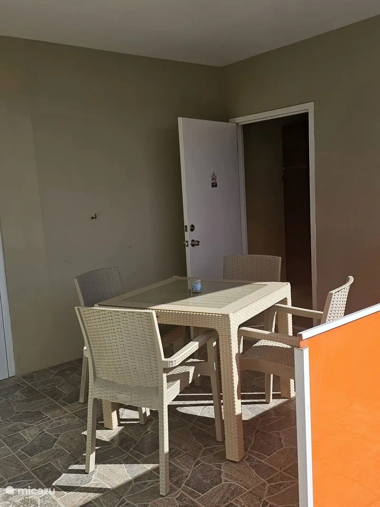 The apartment has a terrace and access to the pool and garden.
