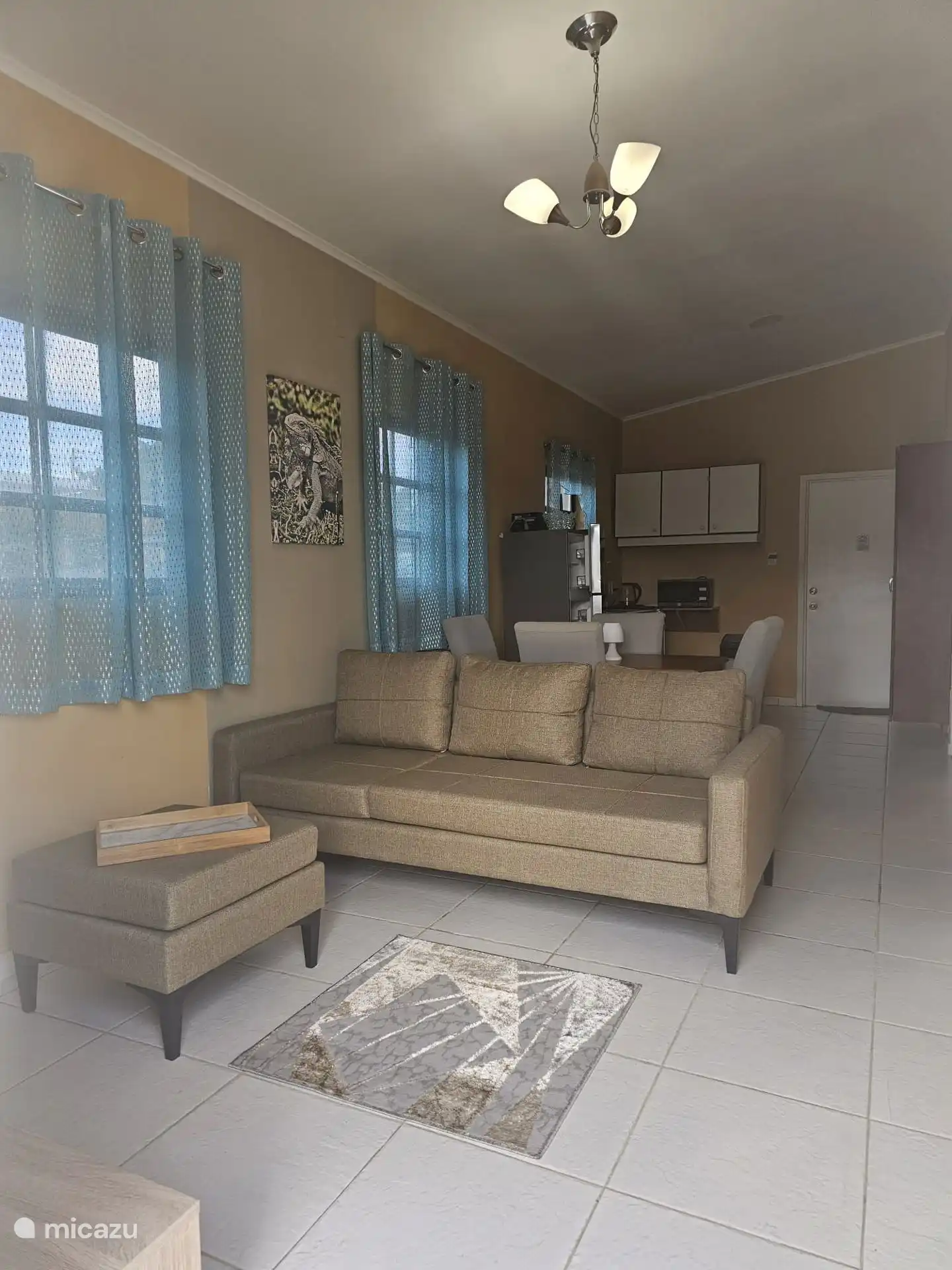 When you enter the apartment you will see a comfortable sitting area and a view of the dining table and kitchen