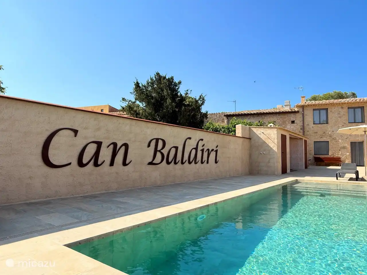 Can Baldiri in handmade metal letters on the wall, that's what the villa used to be called: Can Baldiri