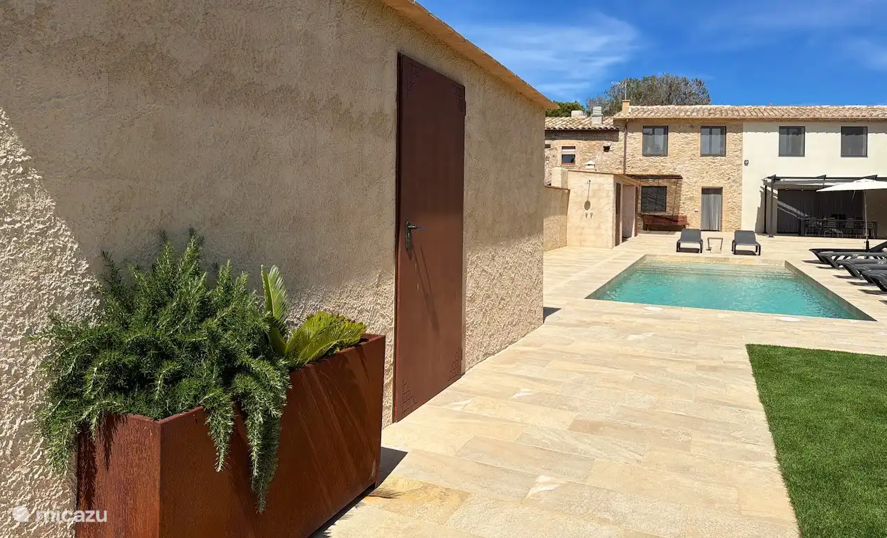 outdoor area with additional toilet and laundry room