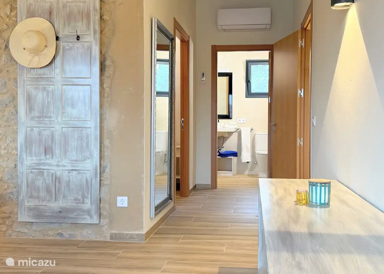 The master bedroom has its own bathroom and wardrobe space.