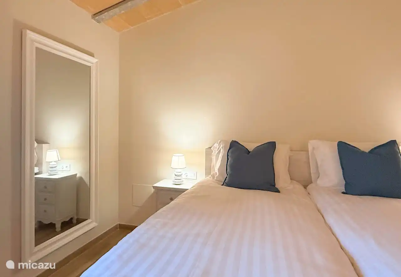 Double bedroom with beds made