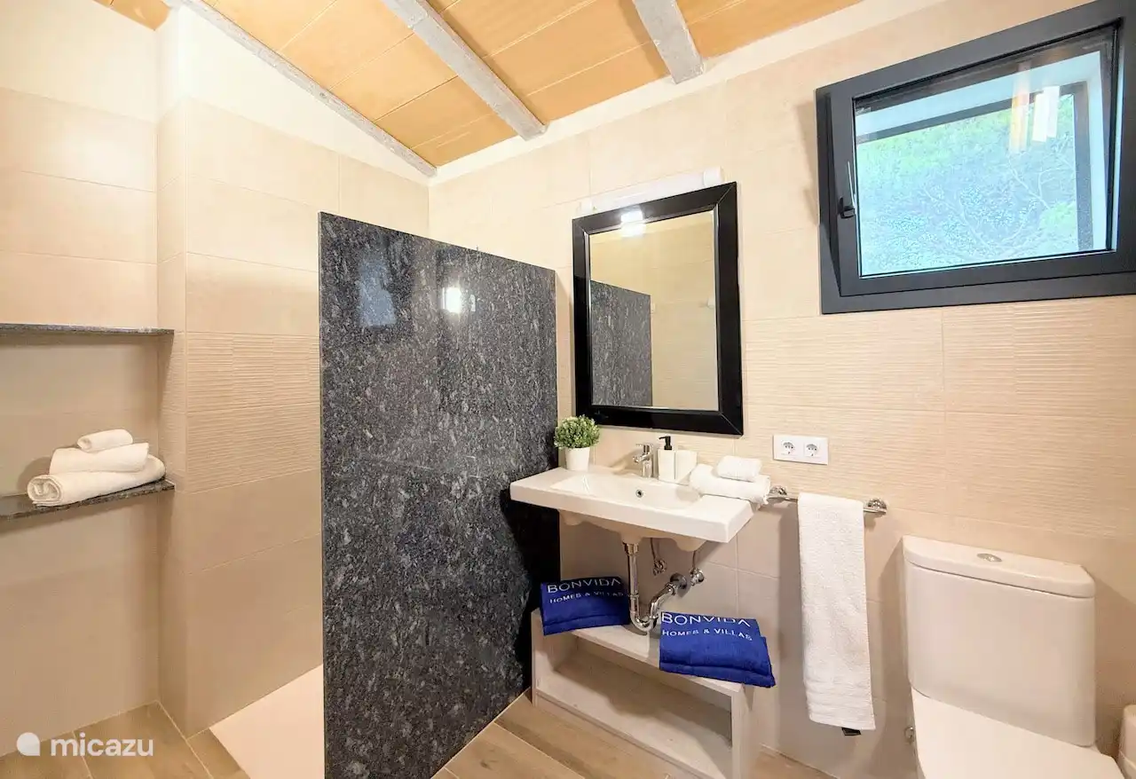 Bathroom with walk-in shower, sink and toilet. We provide sufficient bath linen. (towels, guest towels, bath mat etc). Beach towels can be booked. First toll of toilet paper is available.