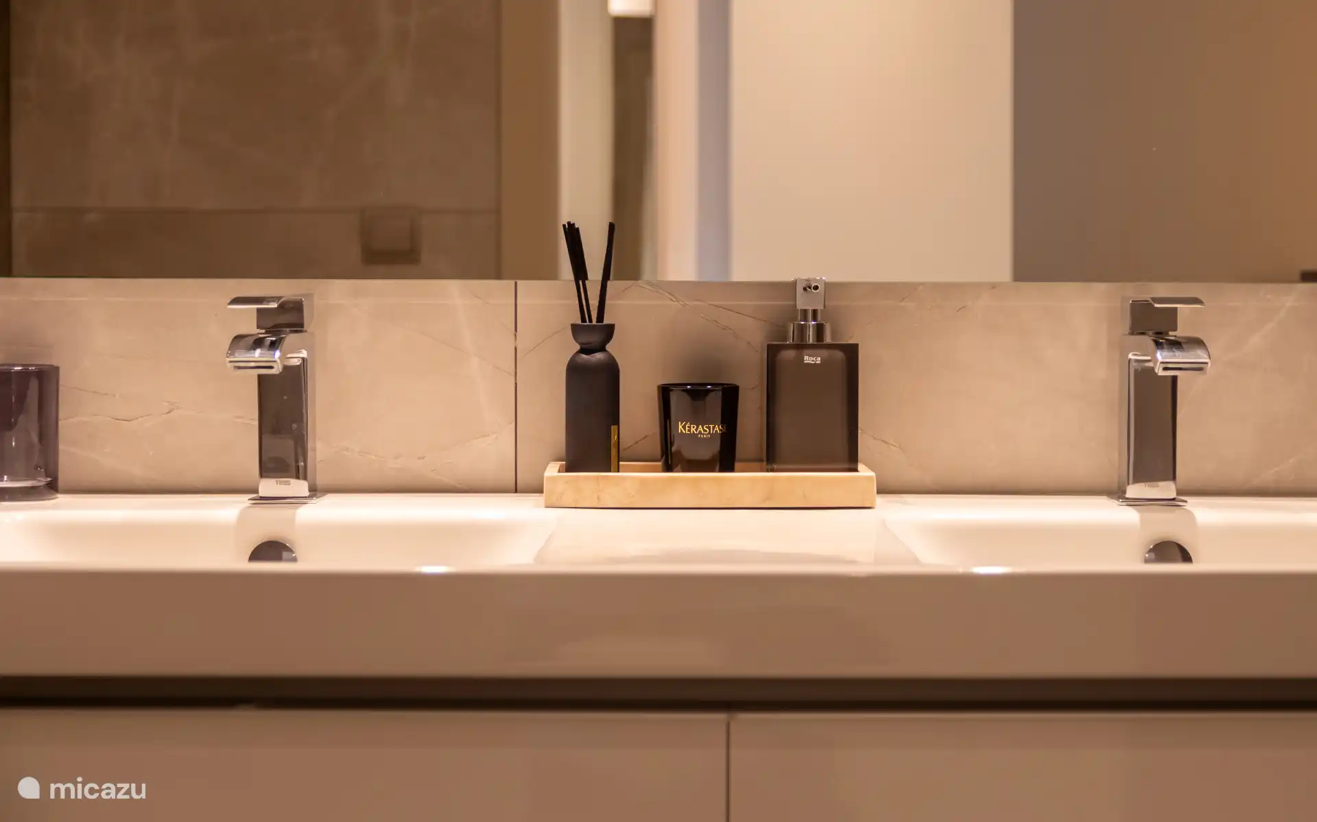 Bathroom detail with double washbasin and care products