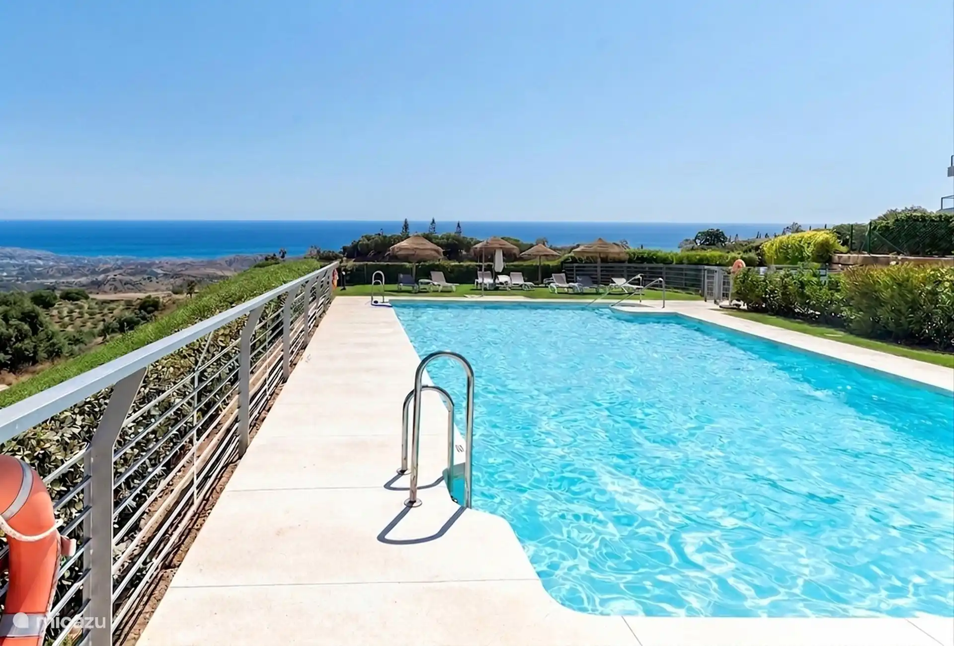 Resort swimming pool with coastal views