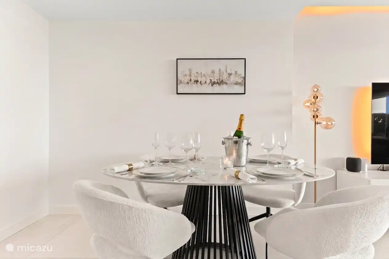 Set dining table with champagne in the bright living room