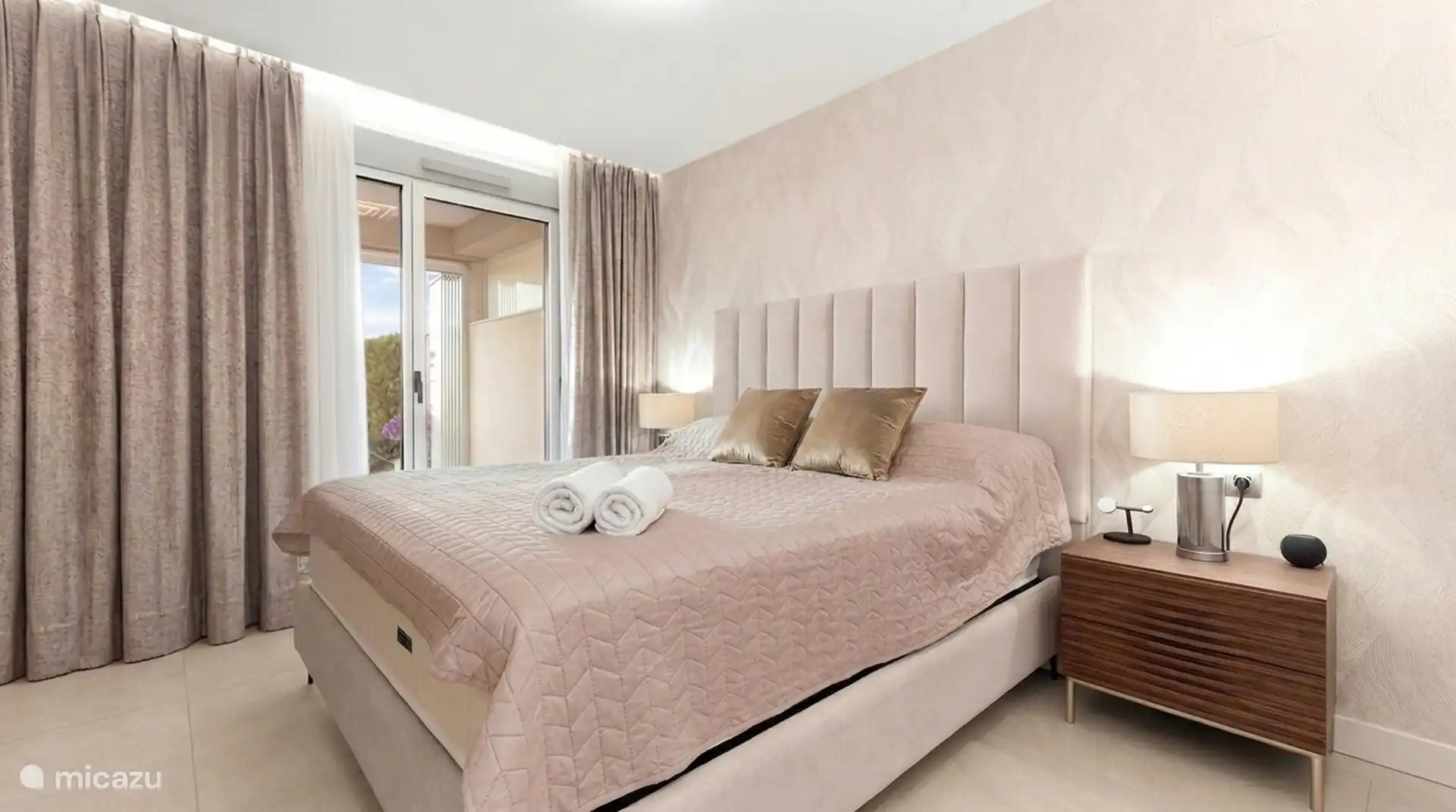 Master bedroom with double bed and access to the terrace