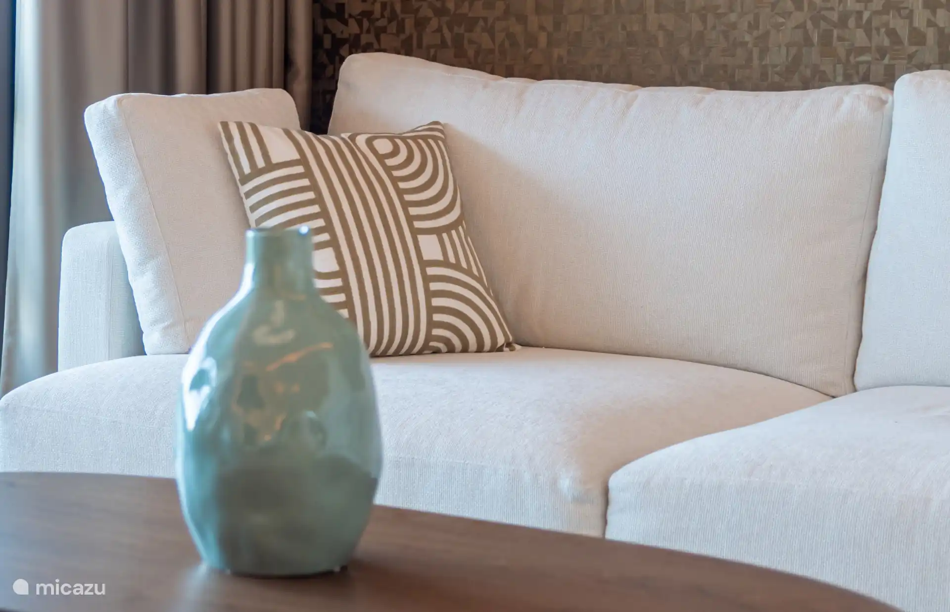 Detail of the lounge sofa with cushions and decoration