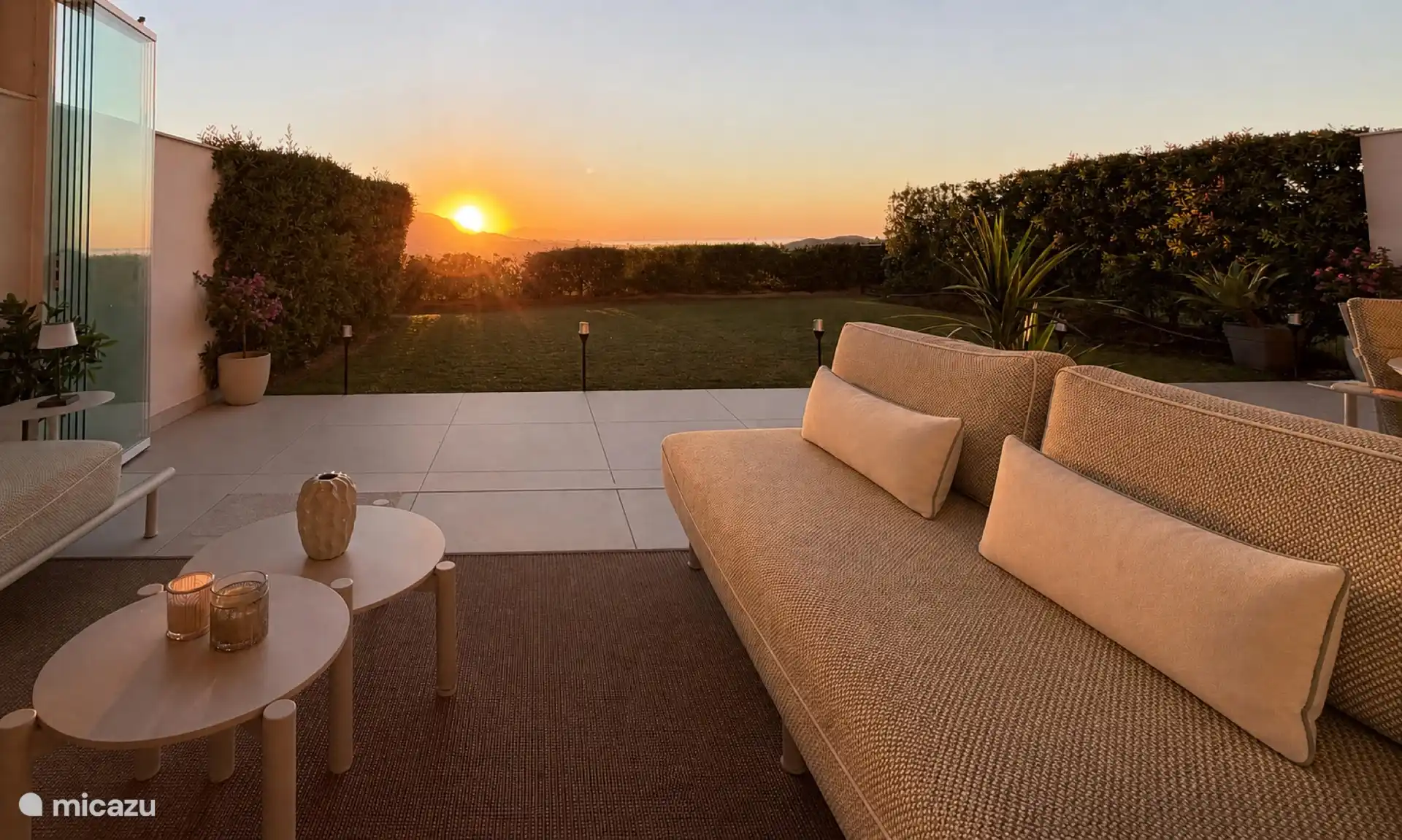 Sunset terrace with lounge sofa and views over the valley
