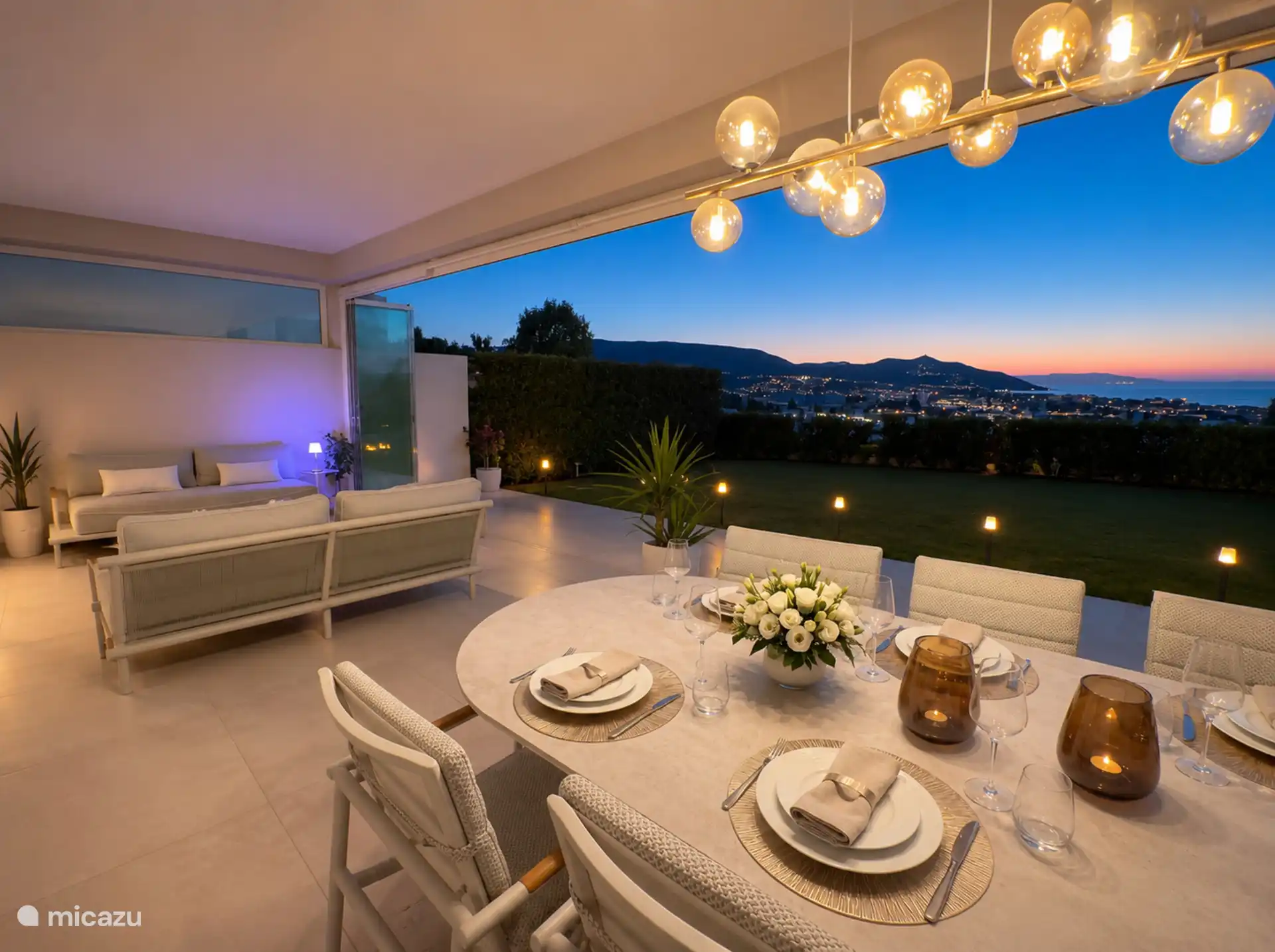 Eat al fresco on the terrace, with views over the mountains and coast as the sun sets.