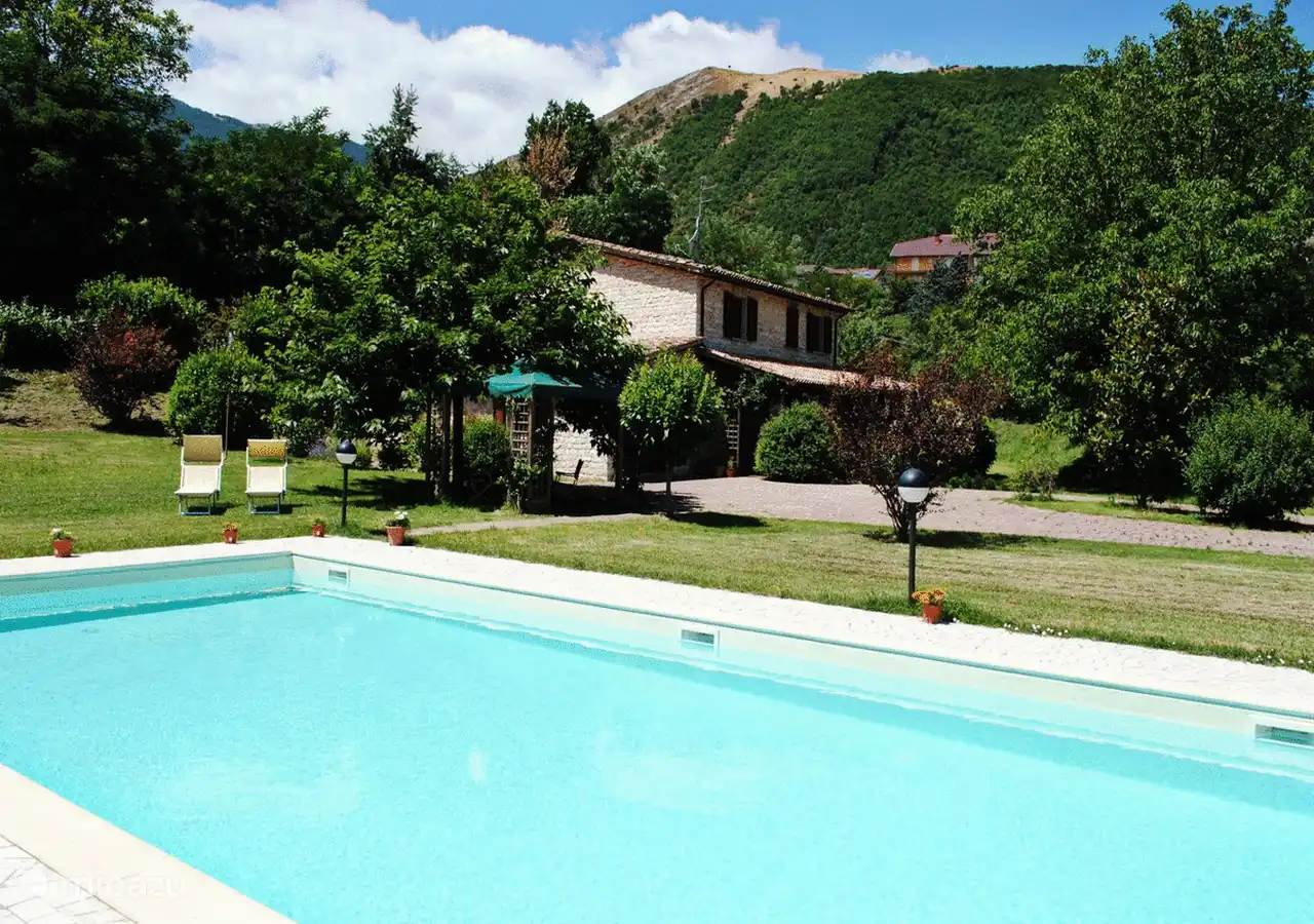 View from the pool to our house and garden