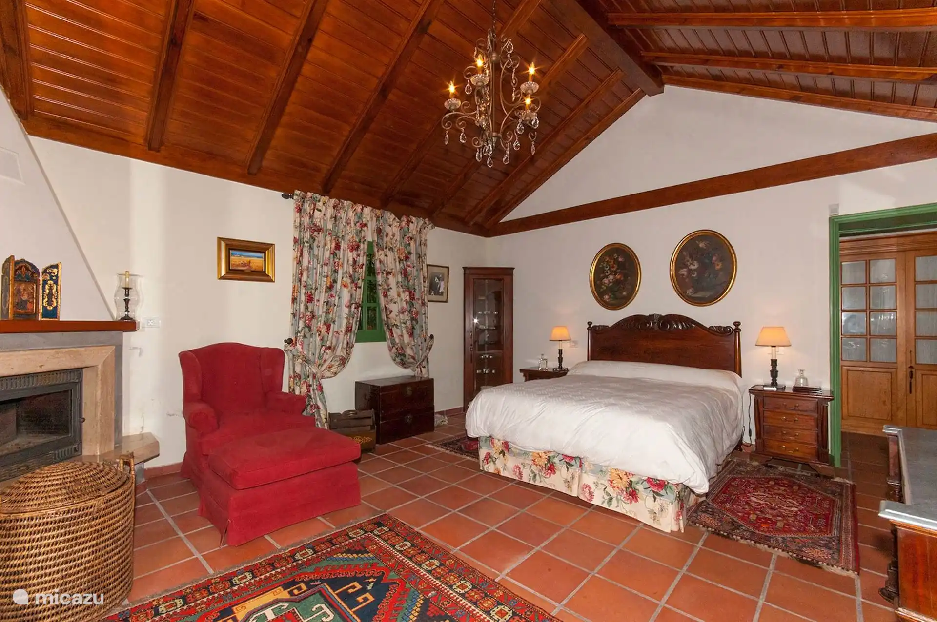 Double bedroom with its own fireplace and reading armchair