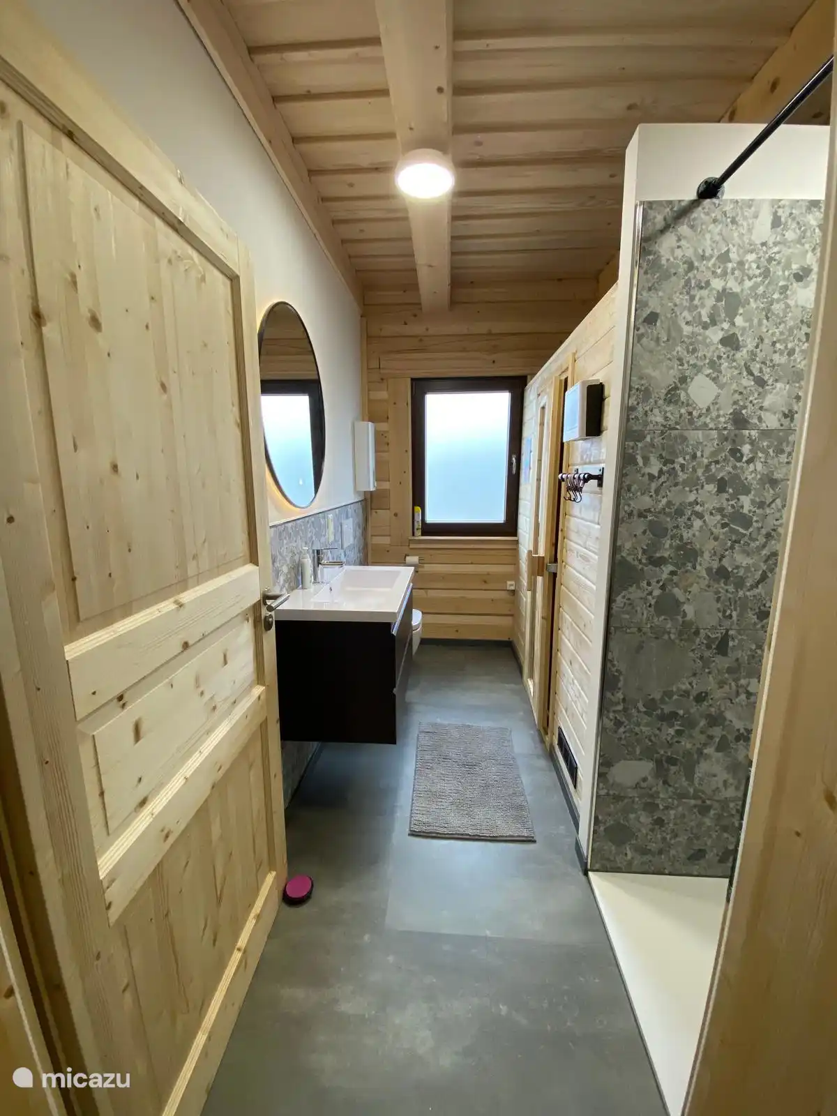 bathroom with large sink, mirror, toilet, walk-in shower and sauna