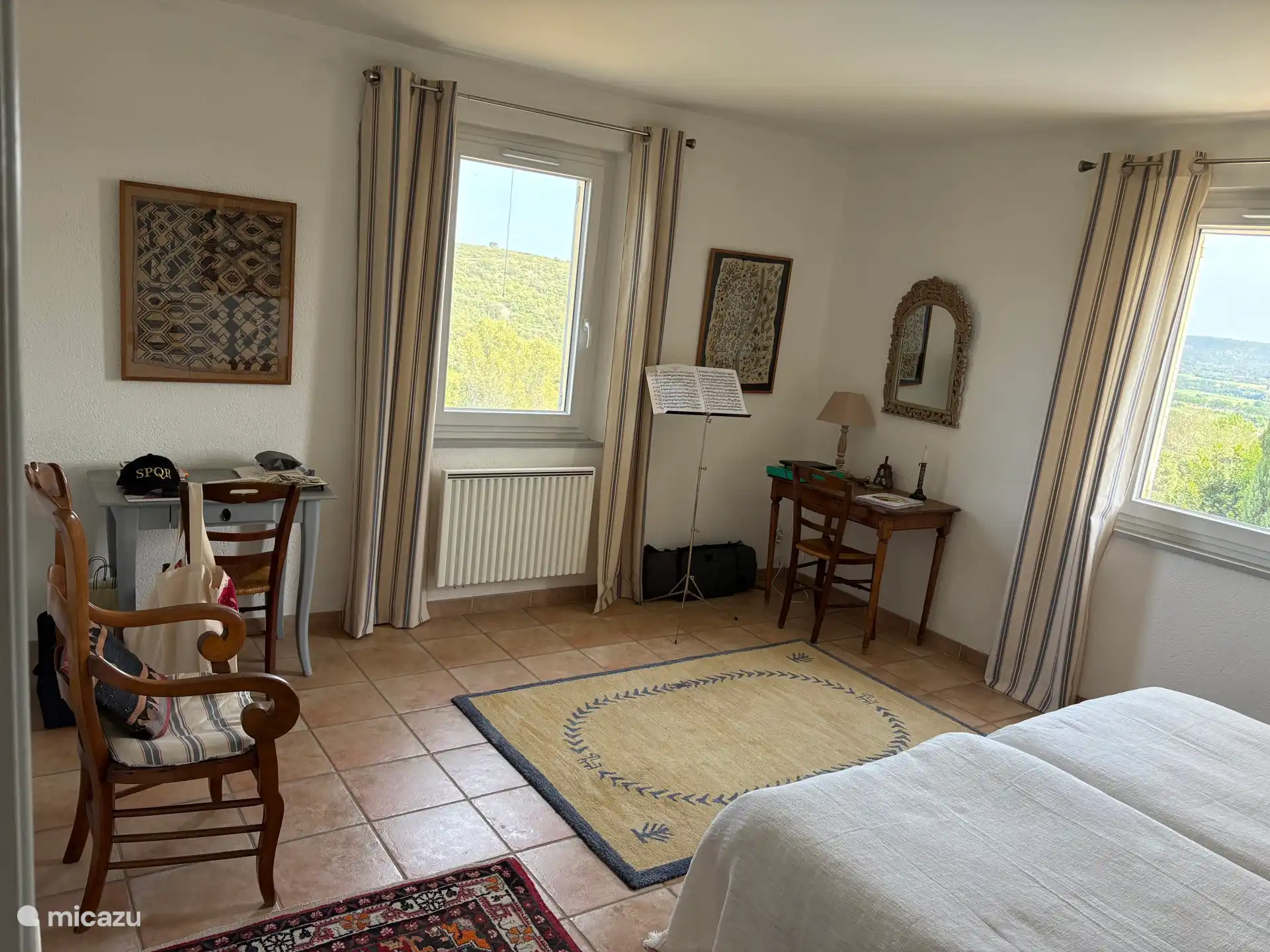 Bedroom 2 with scrubland and pool view 