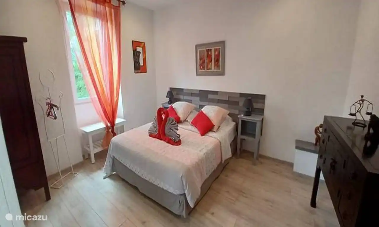 Large double bedroom.
Spacious and elegant room with large double bed, neat decoration, parquet flooring, and bathroom.