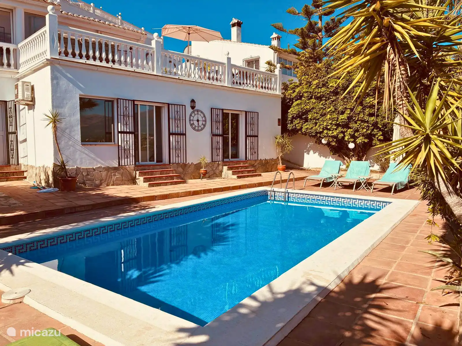 Front of the house viewed from the local terrace next to the outdoor shower
