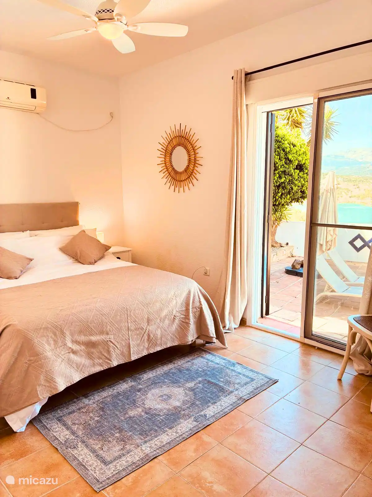 Double bed with direct access to lower terrace and pool