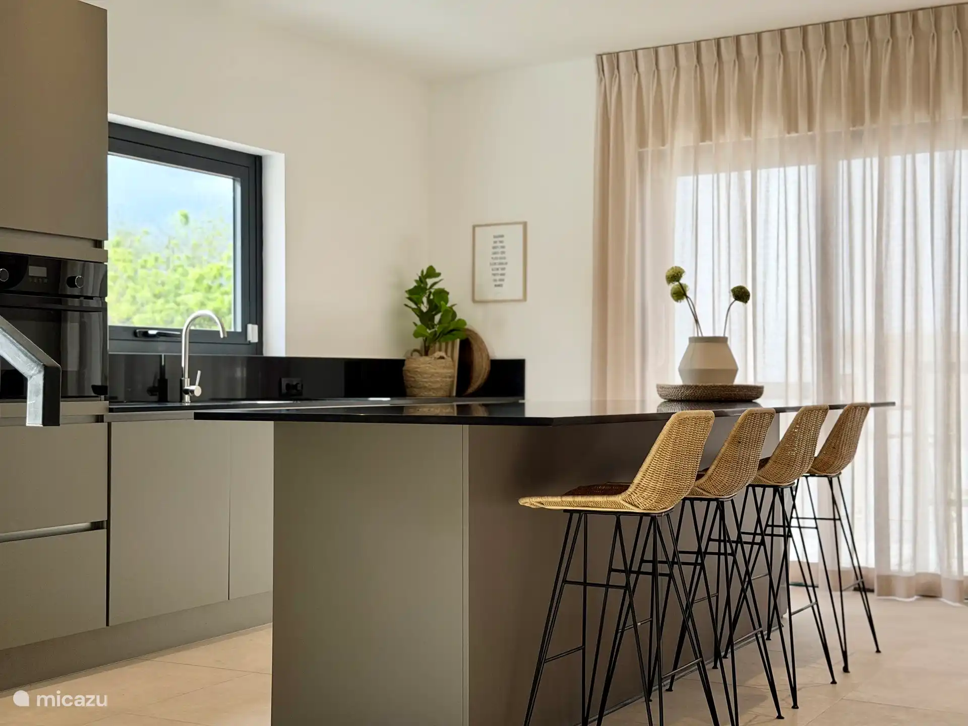 Kitchen with bar chairs